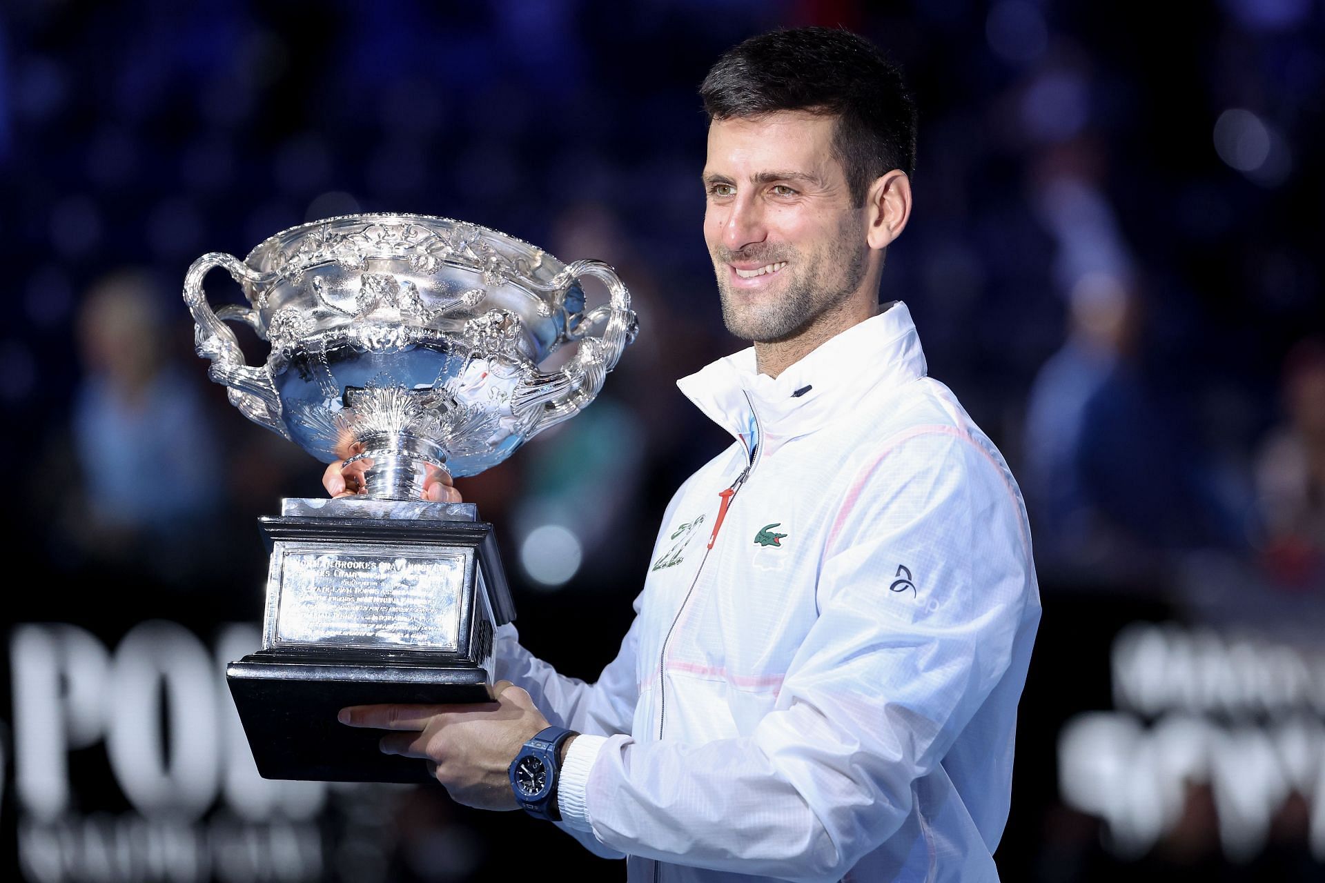 Novak Djokovic with the winner&#039;s trophy at the Australian Open 2023