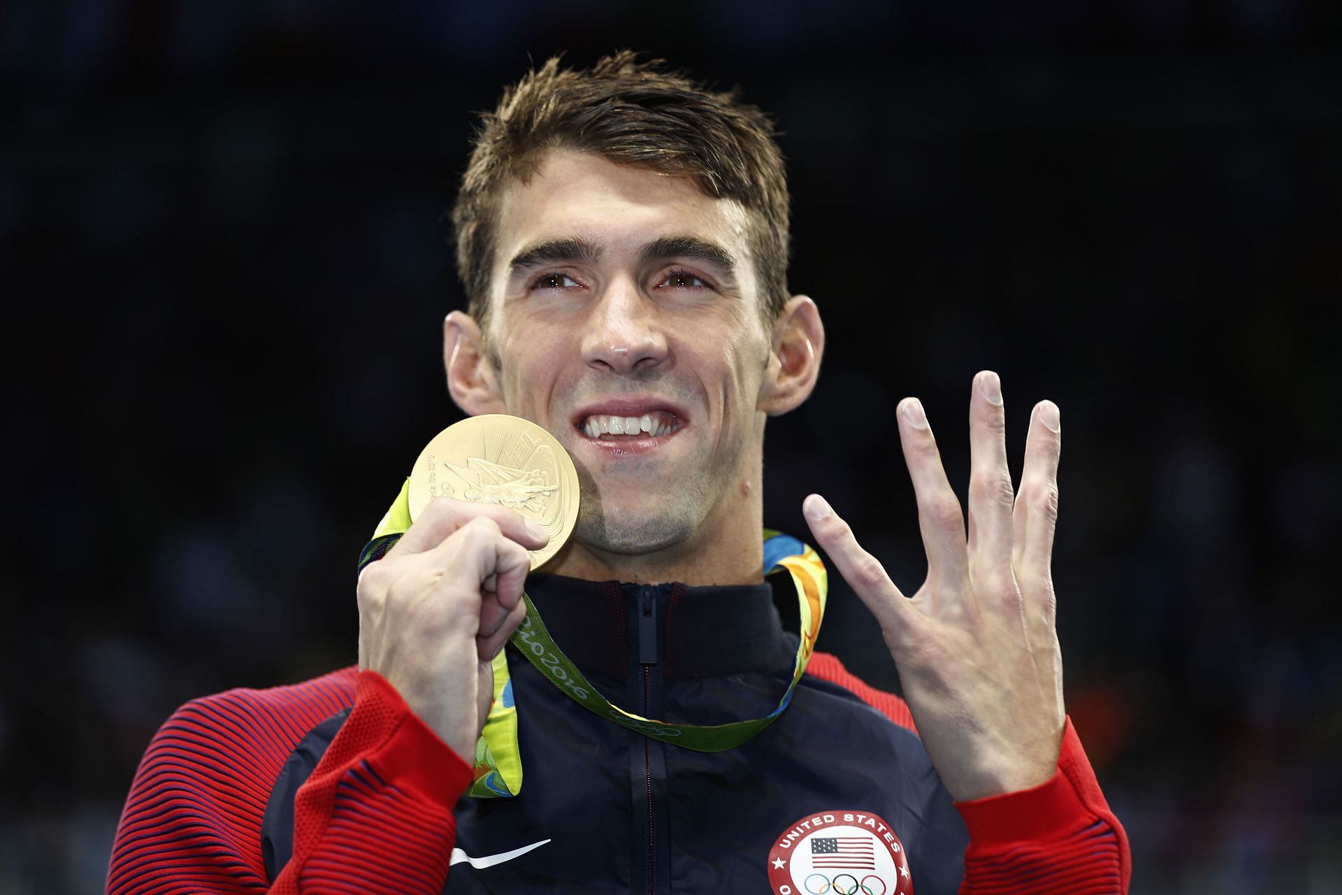 Gold medalist Michael Phelps of the United States celebrates during the medal ceremony for the Men's 200m Individual Medley Final at the Rio 2016 Olympic Games in Brazil.