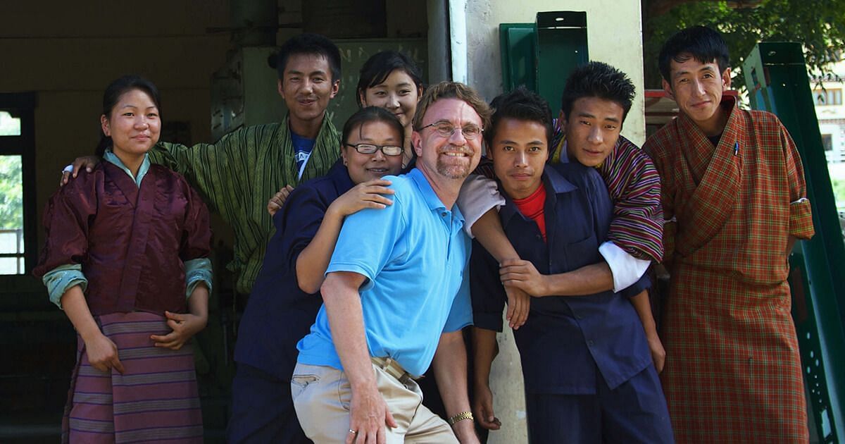 Mike Perkins (center) with his team (image via Christie Digital)