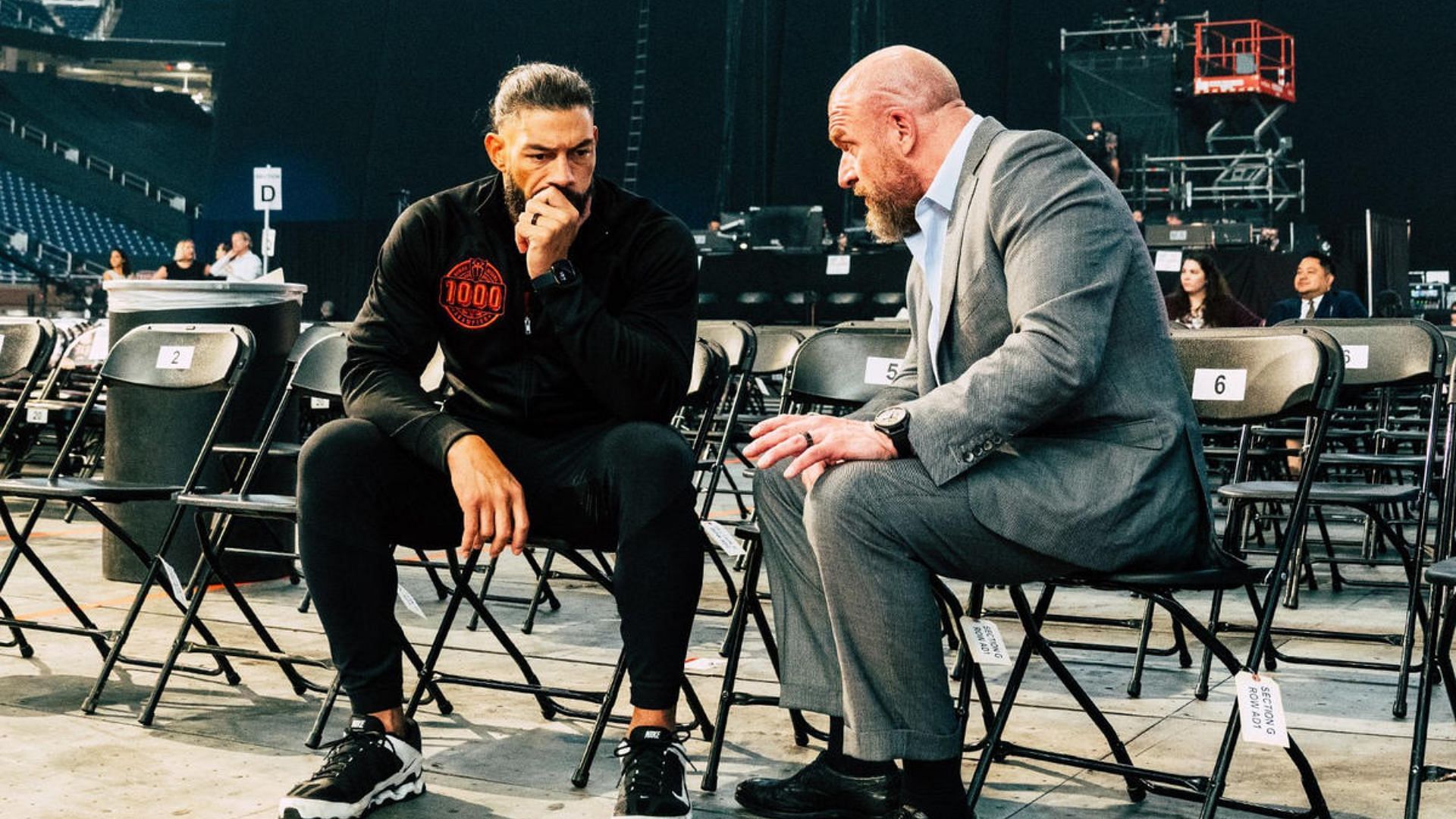 Roman Reigns (left); WWE Chief Content Officer Triple H (right)