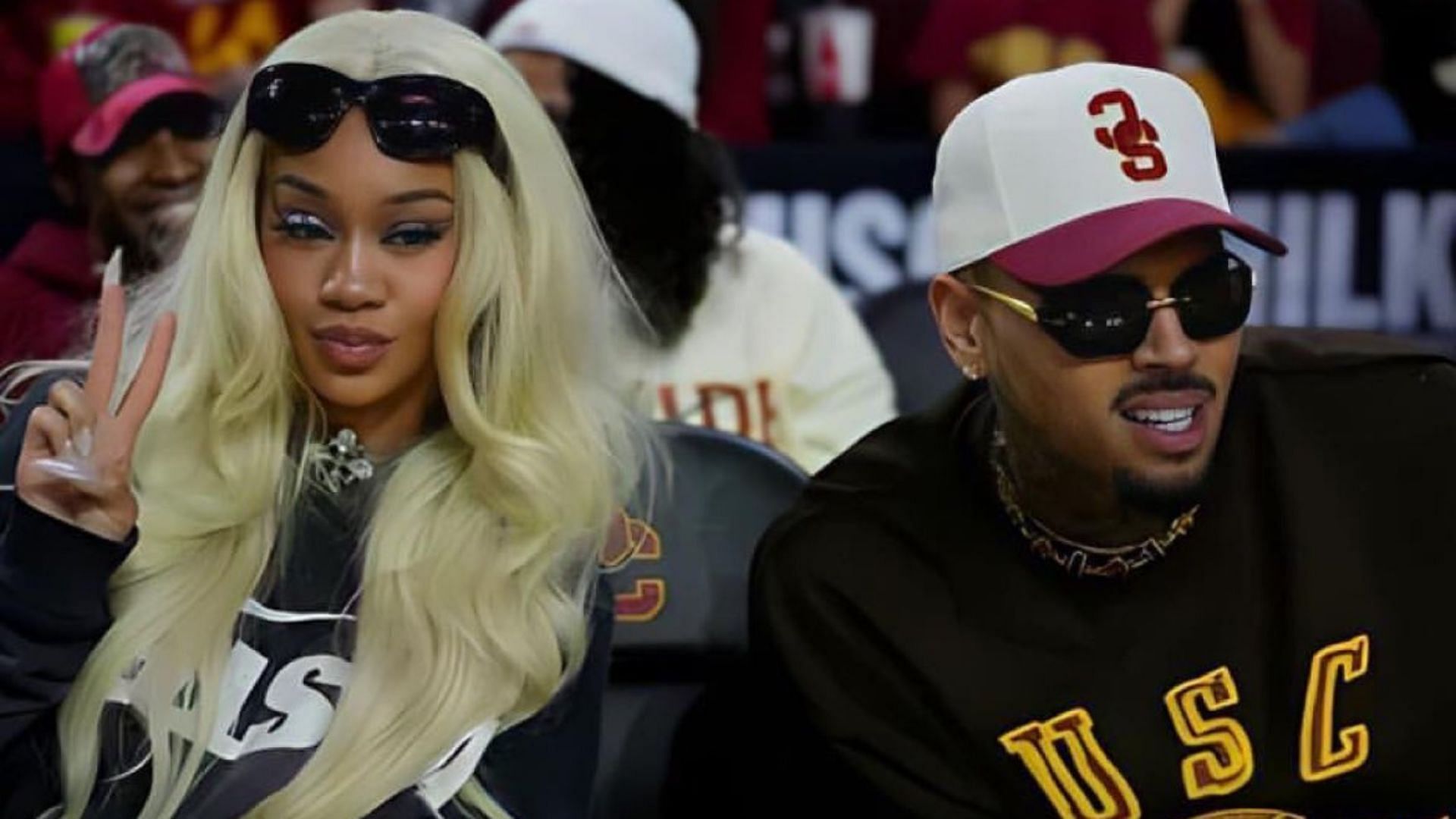 Musicians Saweetie and Chris Brown at a USC basketball game (Image credit: @DailyLoud on Twitter)