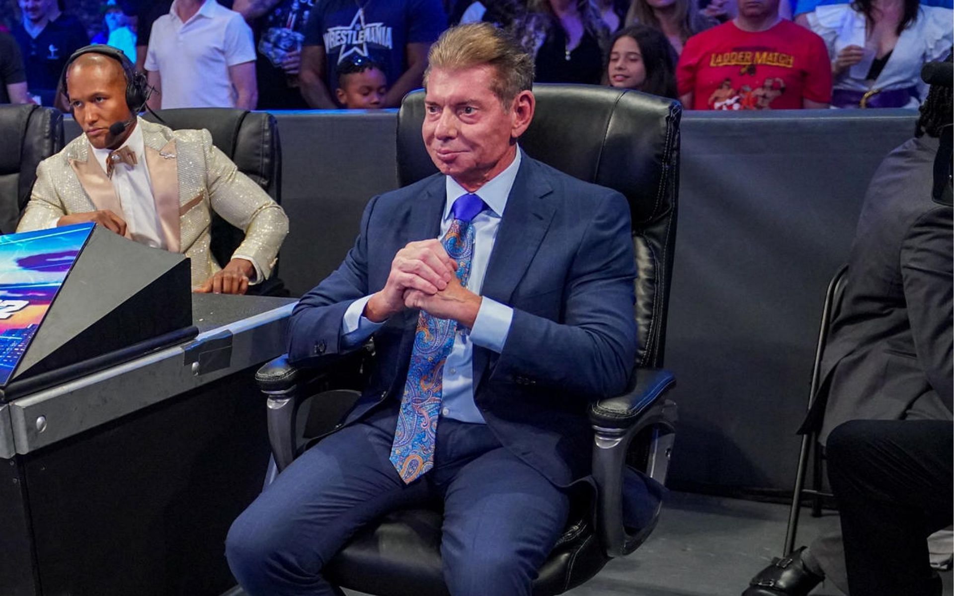 Mr. McMahon sitting at ringside at WrestleMania 38