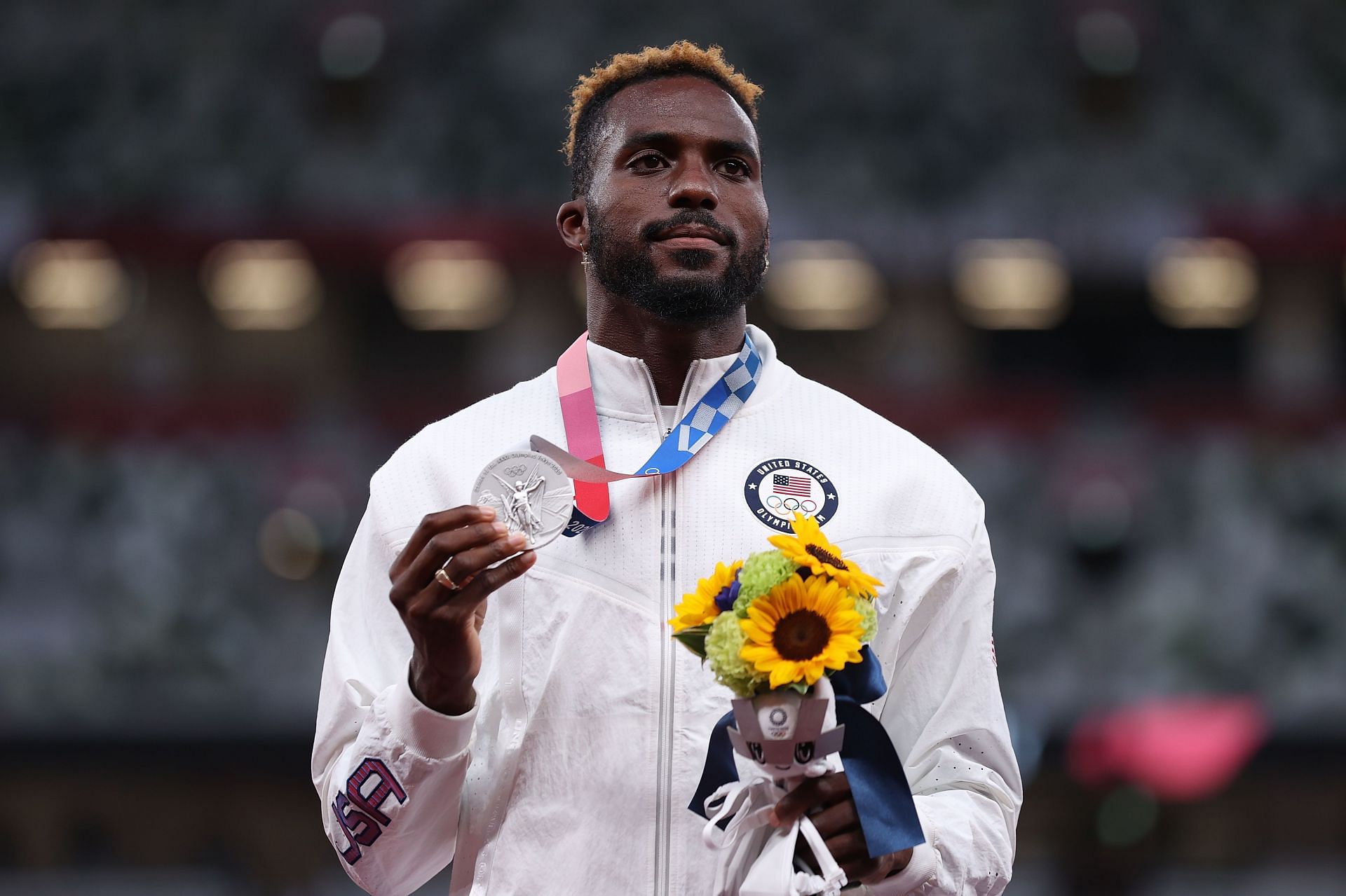 Silver medalist Kenneth Bednarek holds up his medal on the podium during the medal ceremony for the Men&#039;s 200m at the 2020 Olympic Games in Tokyo, Japan.