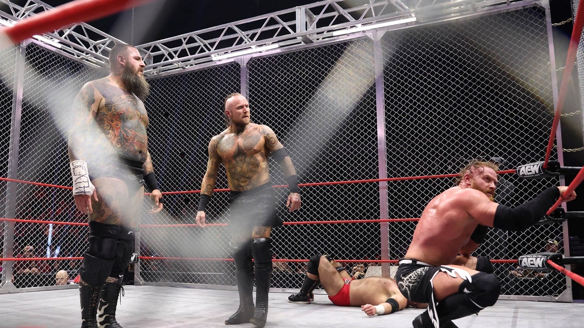 The House of Black inside the steel cage on AEW Collision