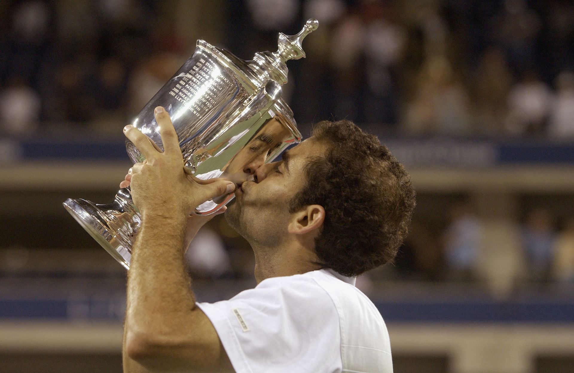 Pete Sampras celebrates winning the 2002 US Open against Andre Agassi - Getty Images