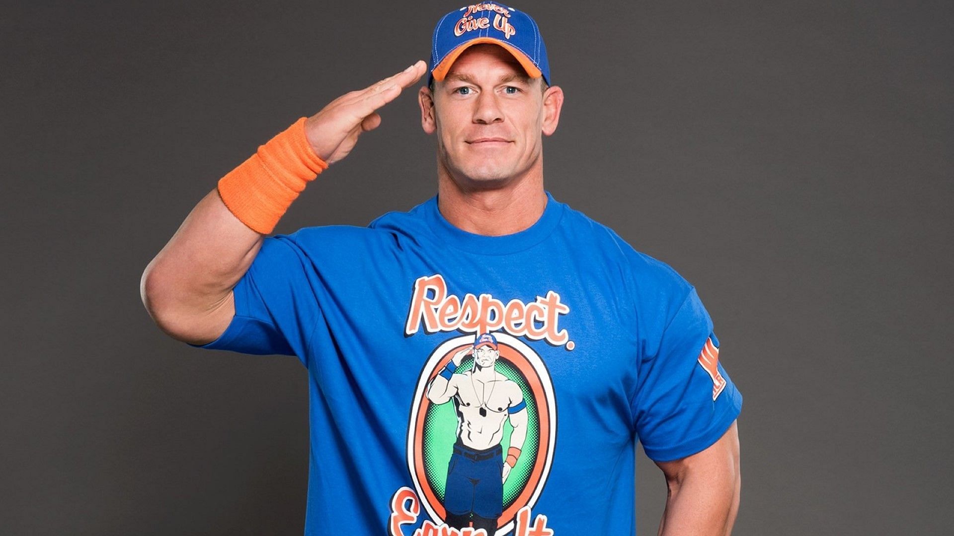 John Cena salutes backstage at a WWE photo shoot