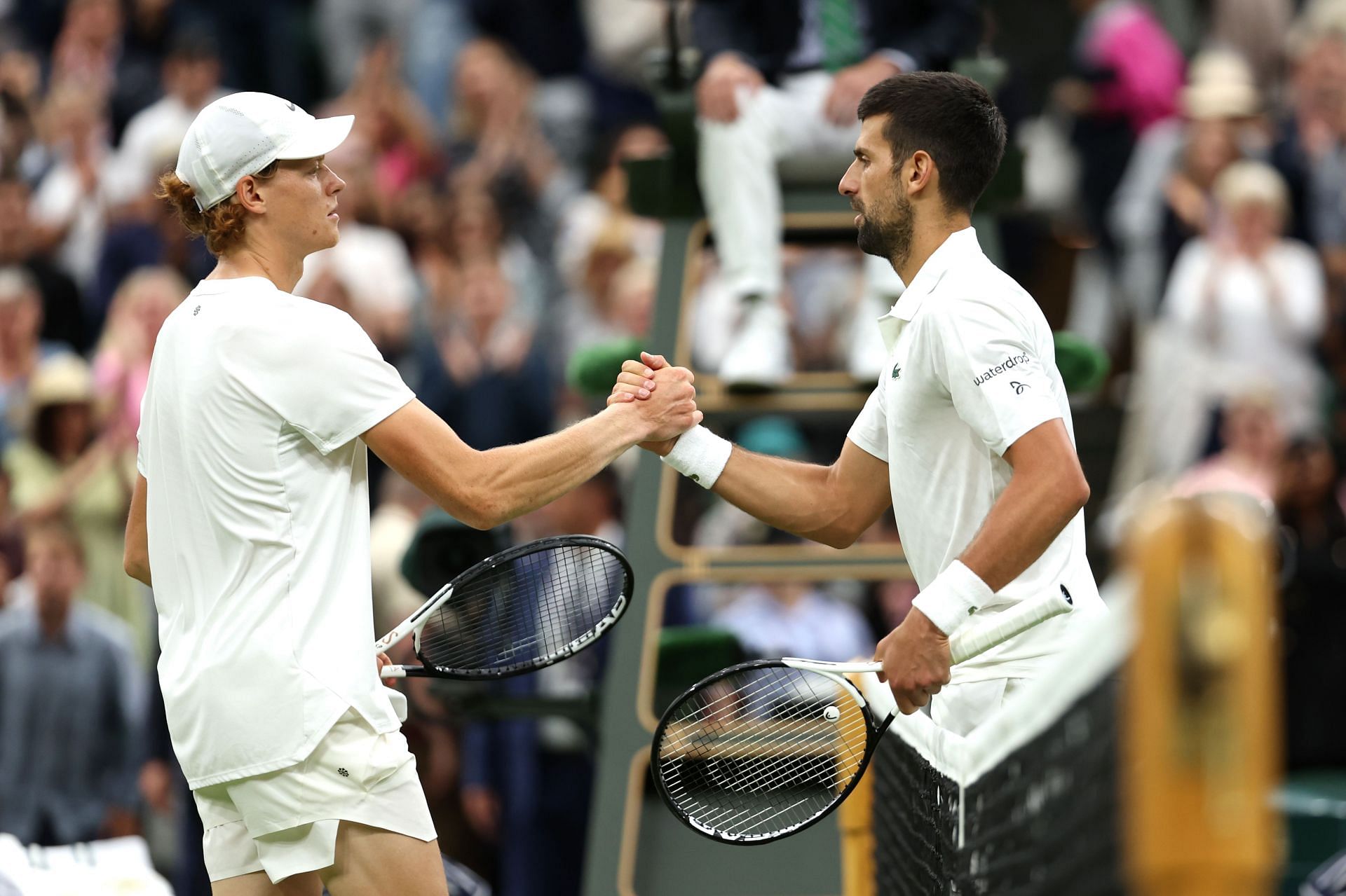 Jannik Sinner (left) lost to Novak Djokovic at Wimbledon last year.