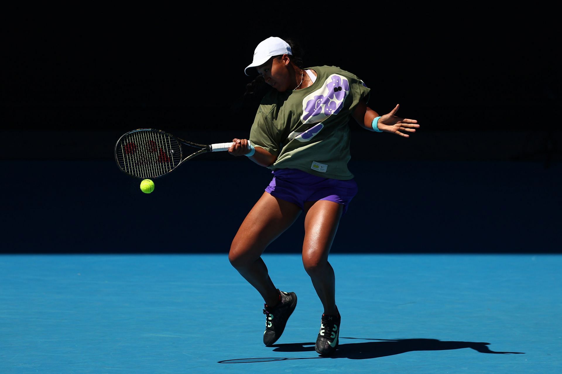 Naomi Osaka of Japan plays a forehand during a training session ahead of the 2024 Australian Open at Melbourne Park - Getty Images