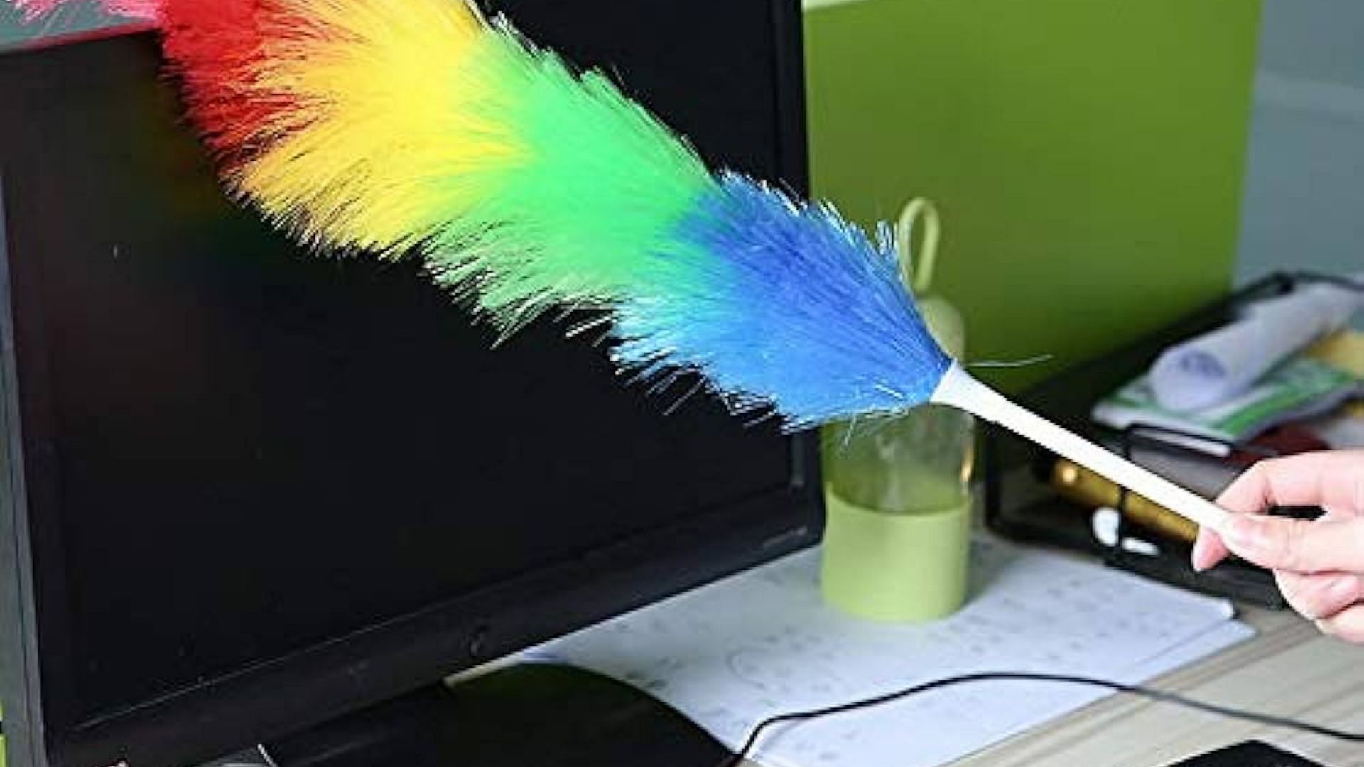 Clean monitor with Swiffer duster (Image via Amazon)