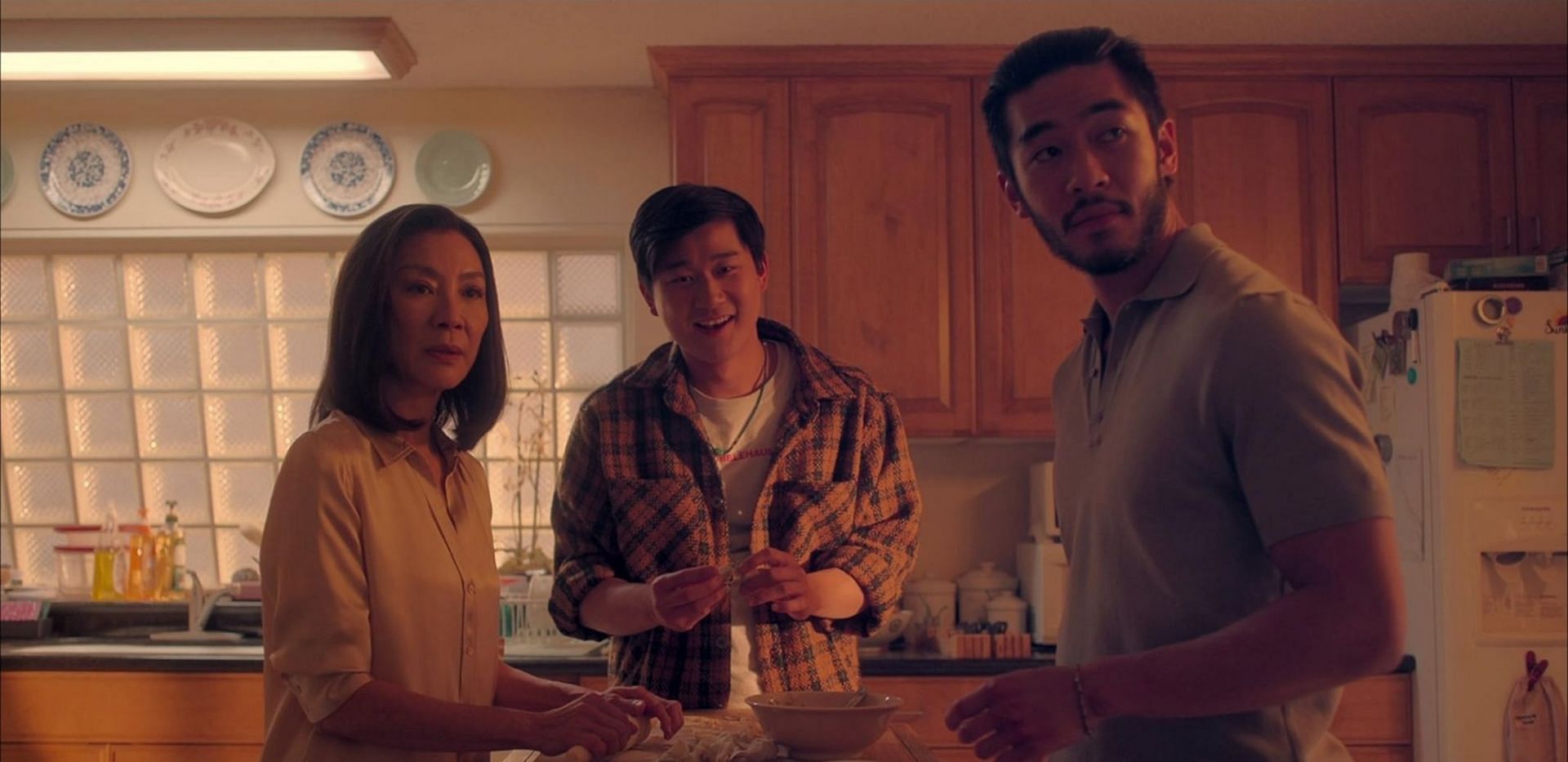Michelle Yeoh, Sam Song Li, and Justin Chien in a scene from The Brothers Sun (Image via IMDb)