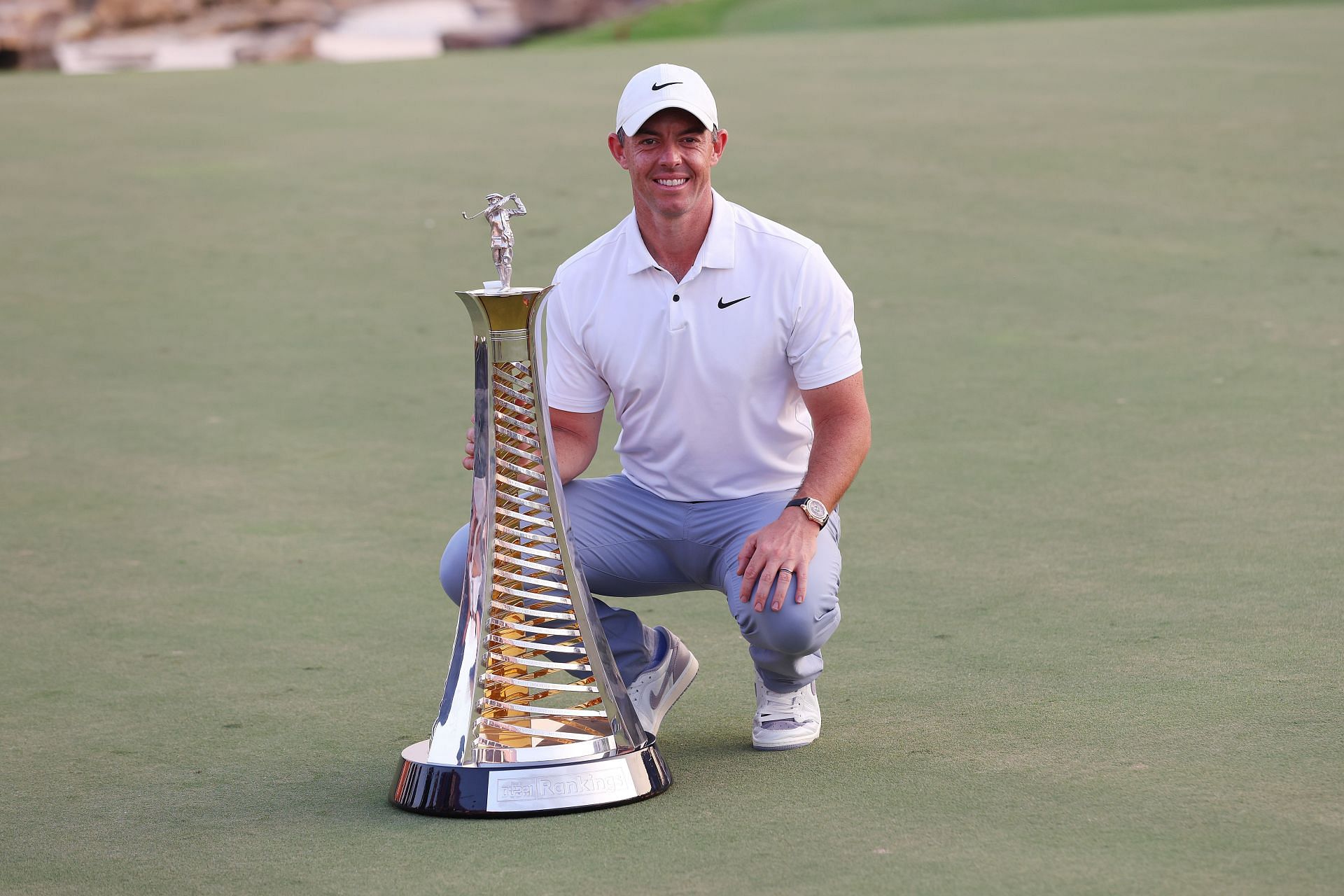 Rory McIlroy poses with the Race to Dubai trophy at the DP World Tour Championship 2023