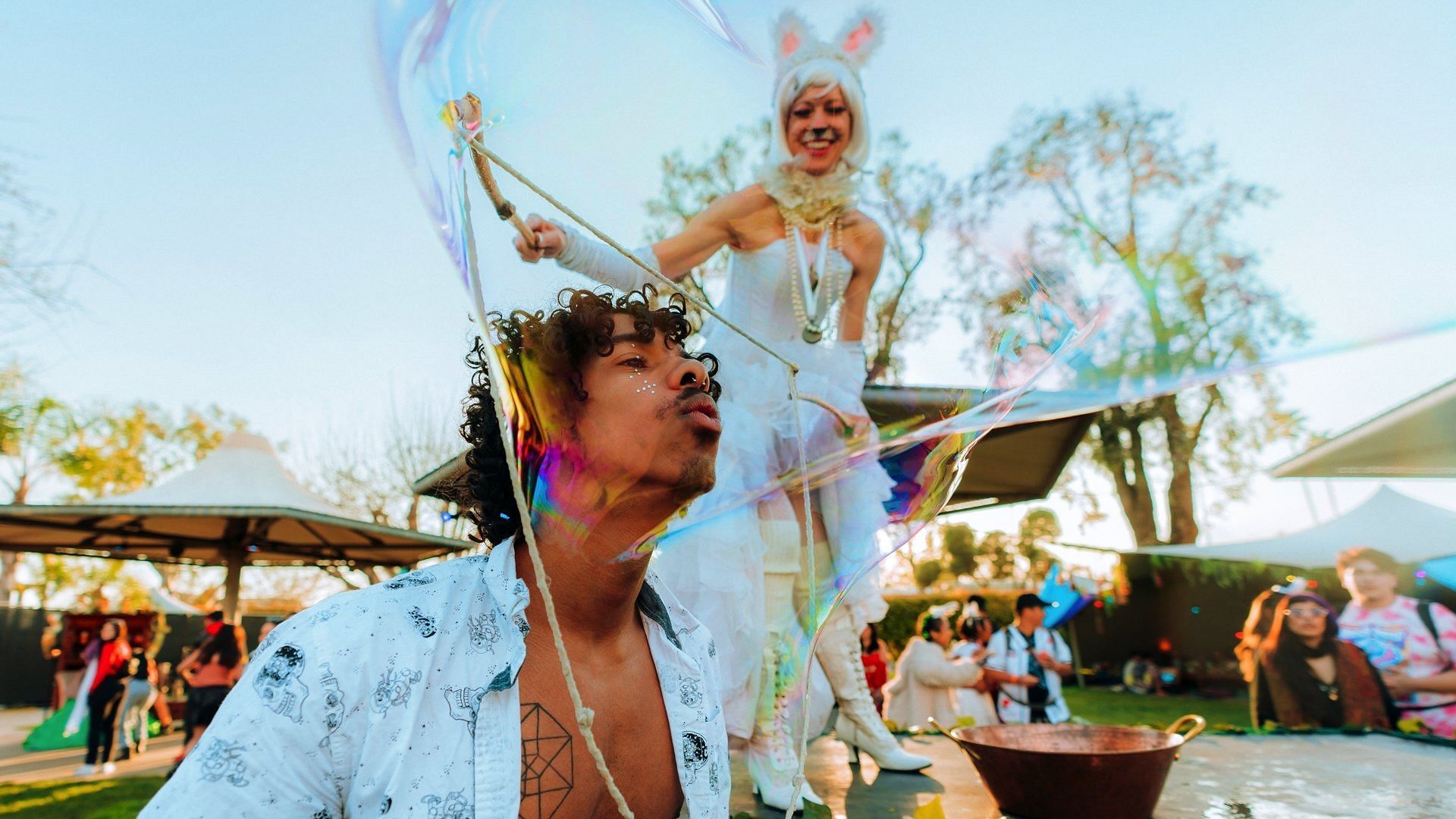 Fan engaging with a performer at Beyond Wonderland 2023 (Image via X/ @BeyondWland)