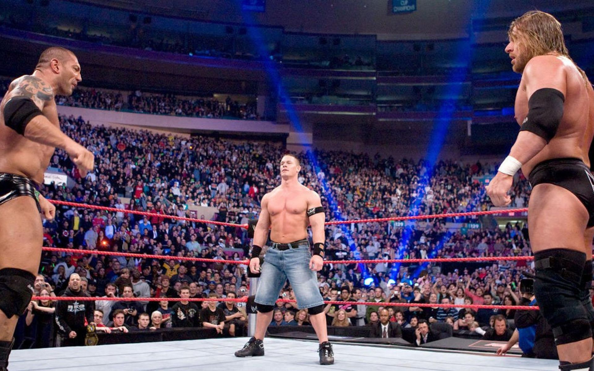 John Cena is having a showdown with Batista and Triple H.