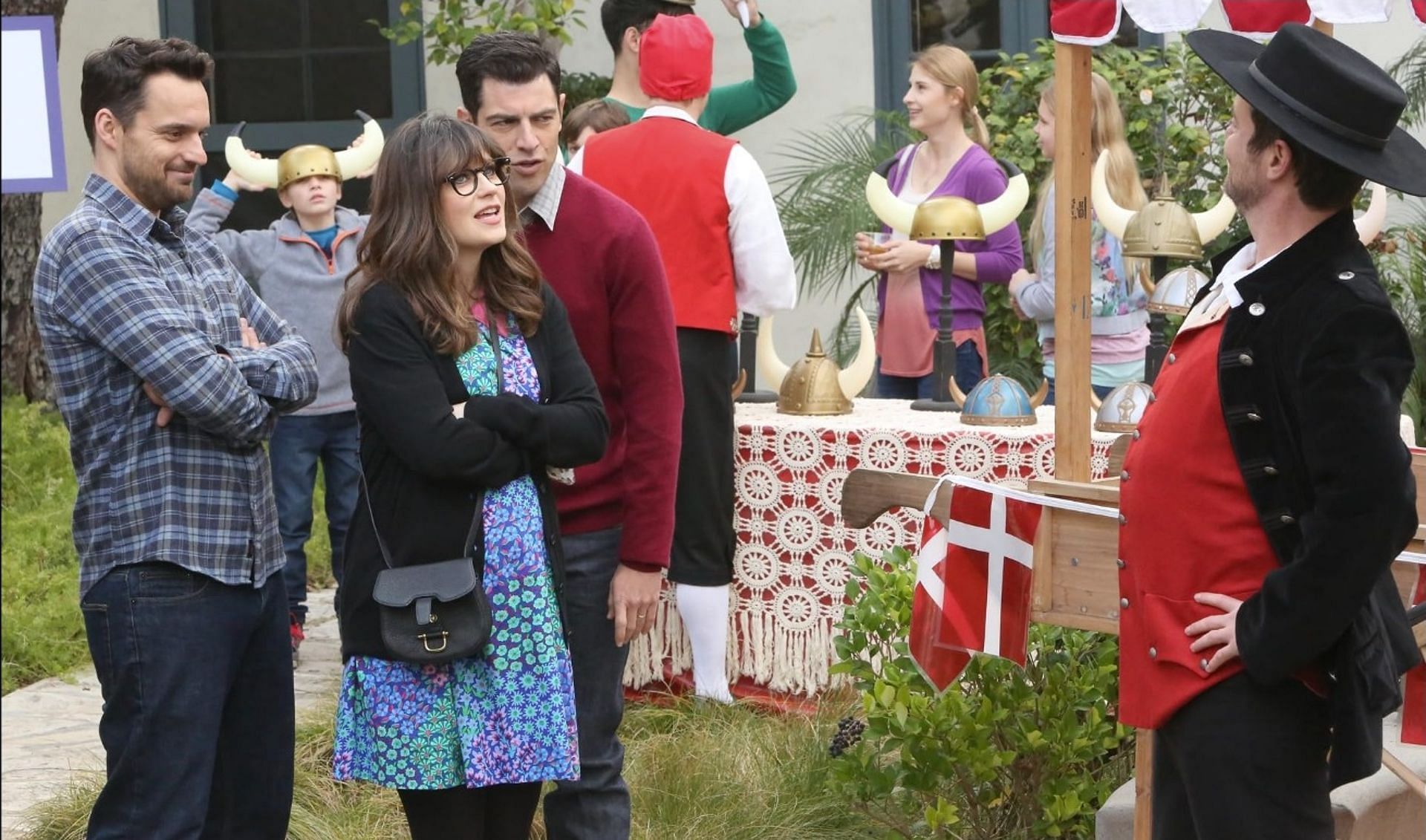 Zooey Deschanel, Max Greenfield, and Jake Johnson in a scene from New Girl (Image via IMDb)