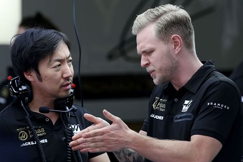 Ayao Komatsu in conversation with Haas' Kevin Magnussen during the 2019 F1 season's winter testing in Barcelona (Photo by Charles Coates/Getty Images)