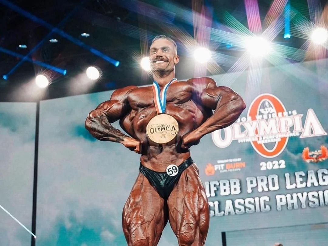 Chris Bumstead competing on stage professionally (Image via Instagram/@cbum)