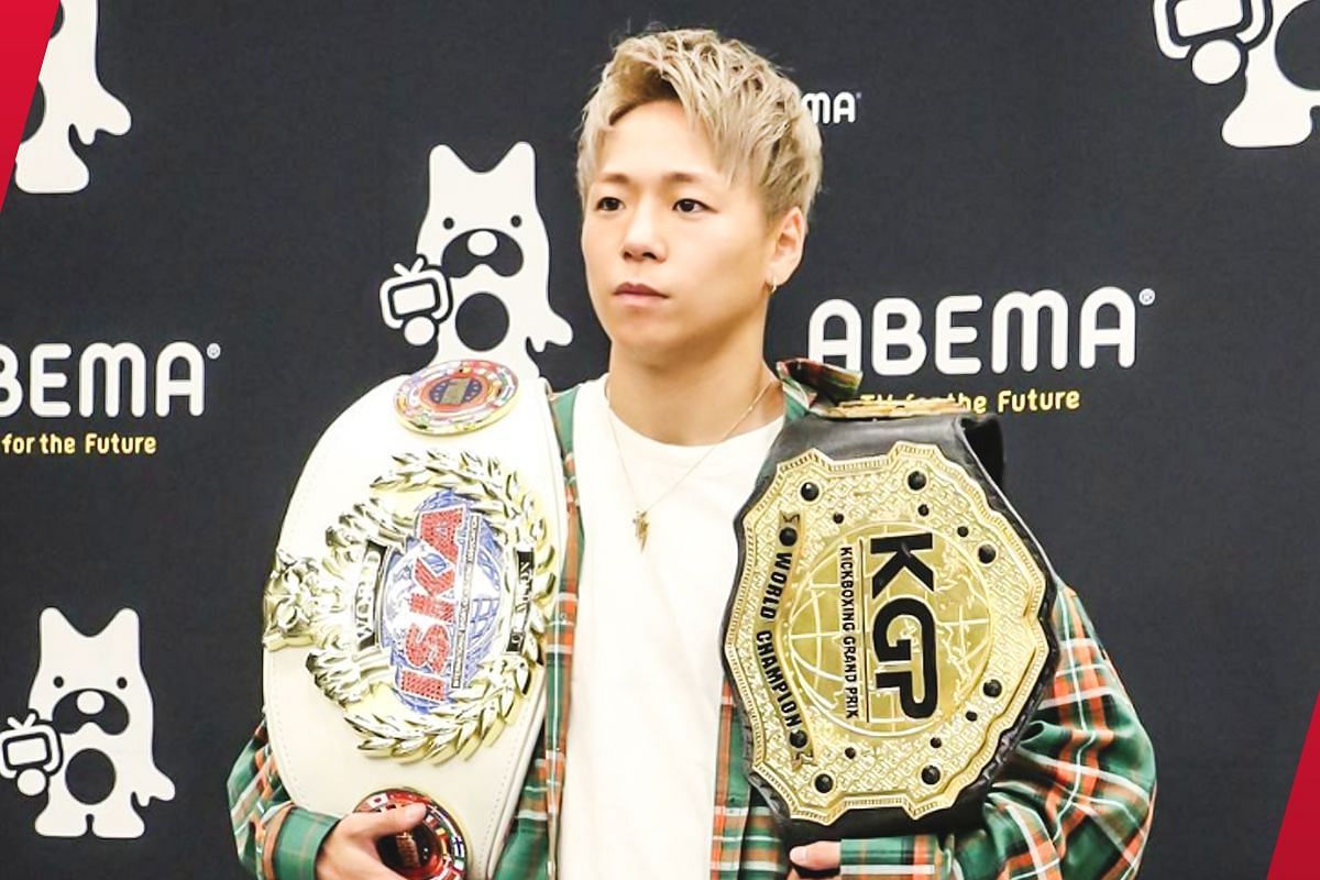 Takeru Segawa holding two of his championships