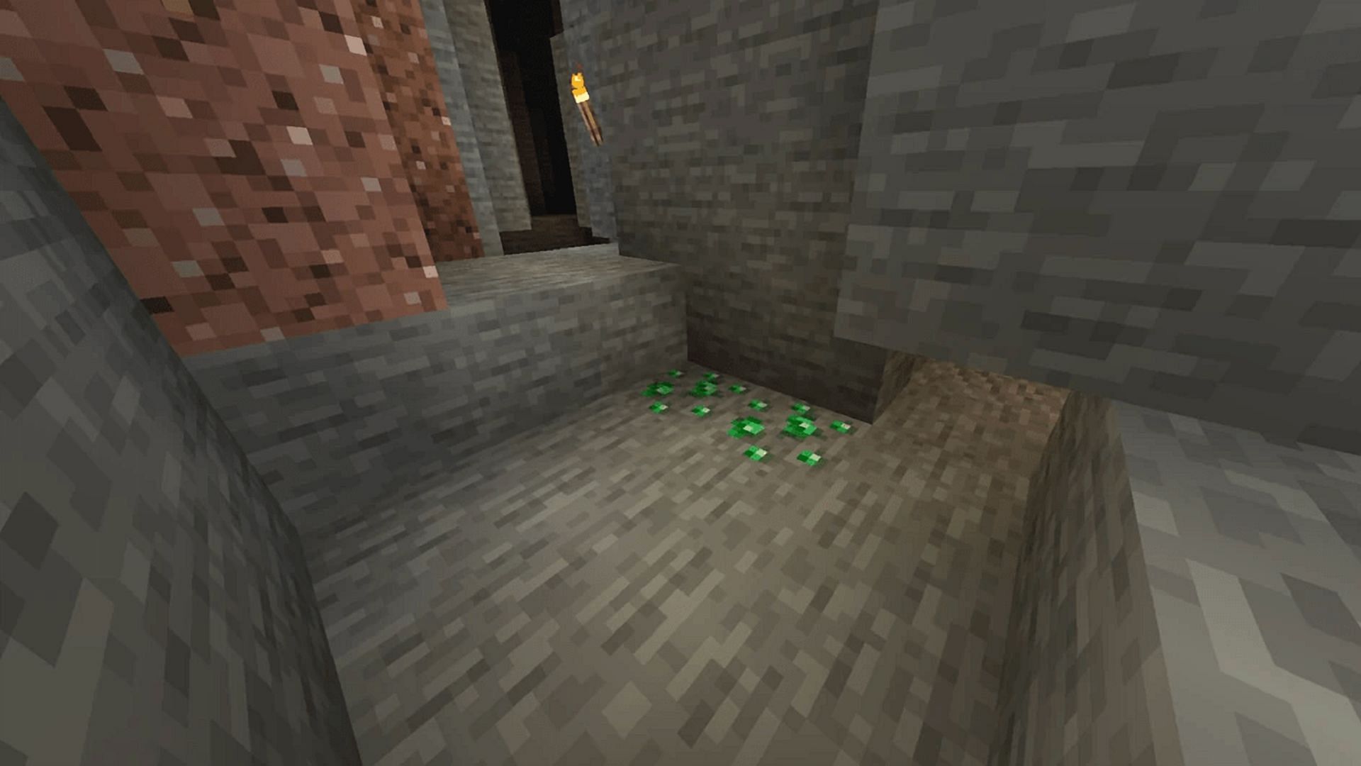 Emeralds and their ore blocks only have a few real uses in Minecraft (Image via Mojang)