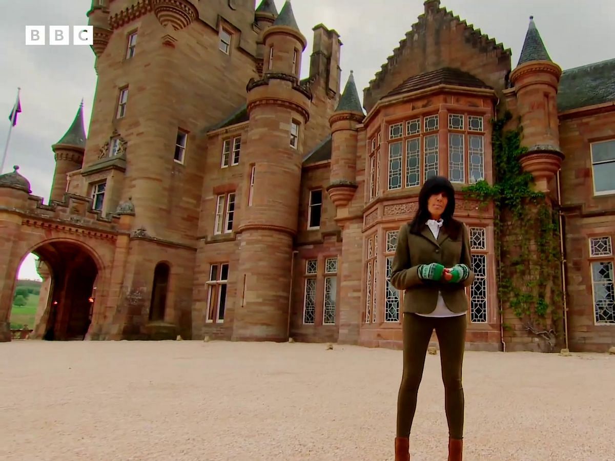 Claudia Winkleman in front of the Ardross Castle, the shooting location of The Traitors Season 2 (Image via YouTube/@BBC)