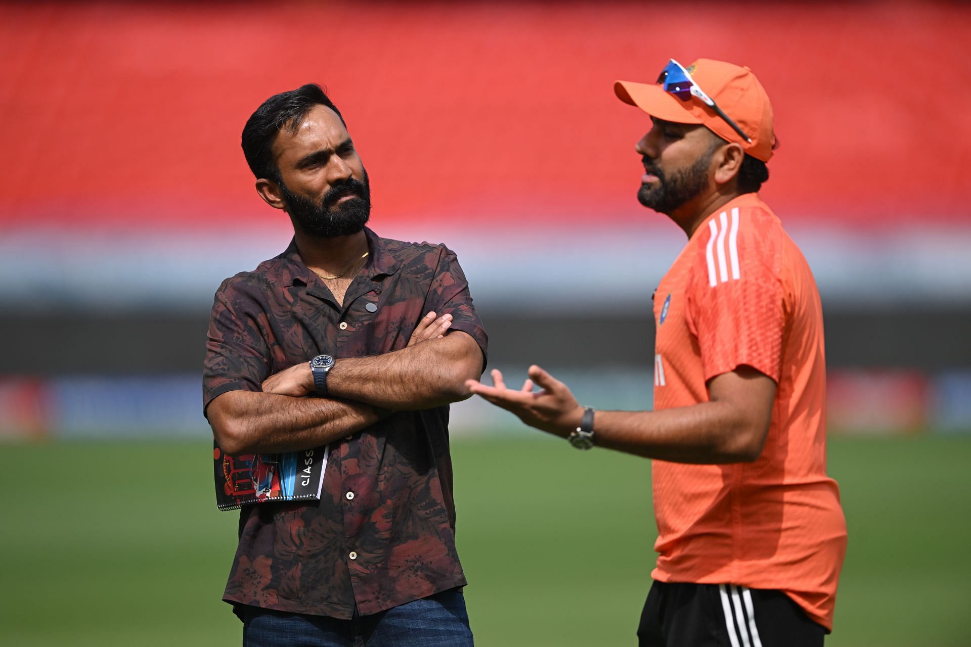 Karthik chatting with Indian skipper Rohit Sharma ahead of the first Test.