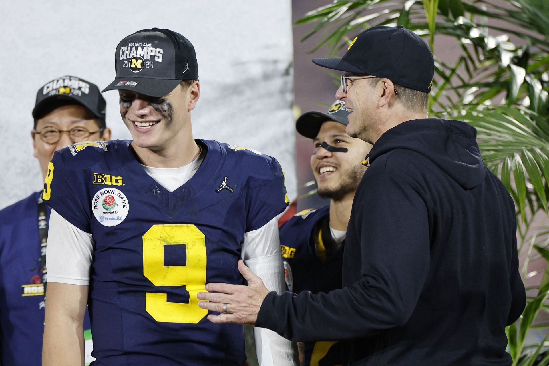 <a href='https://www.sportskeeda.com/player/j-j-mccarthy' target='_blank' rel='noopener noreferrer'>J.J. McCarthy</a> with Jim Harbaugh