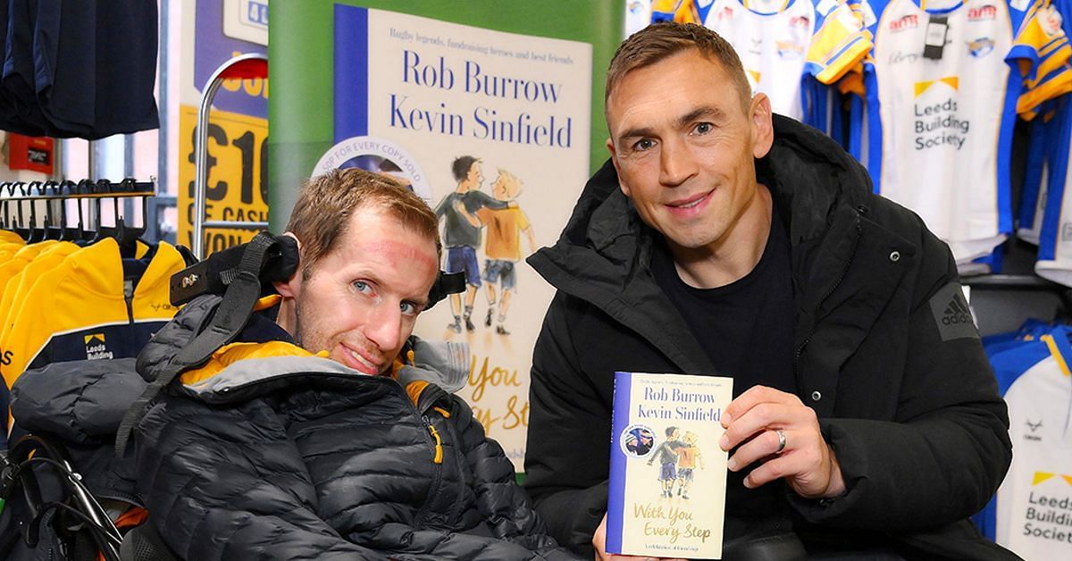 Rob Burrow and Kevin Sinfield with their book (Image via X/@Rob7Burrow)