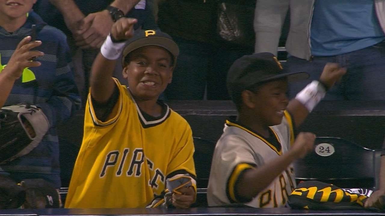 Andrew McCutchen gives two young Pirates fans his gloves at MLB Stadium