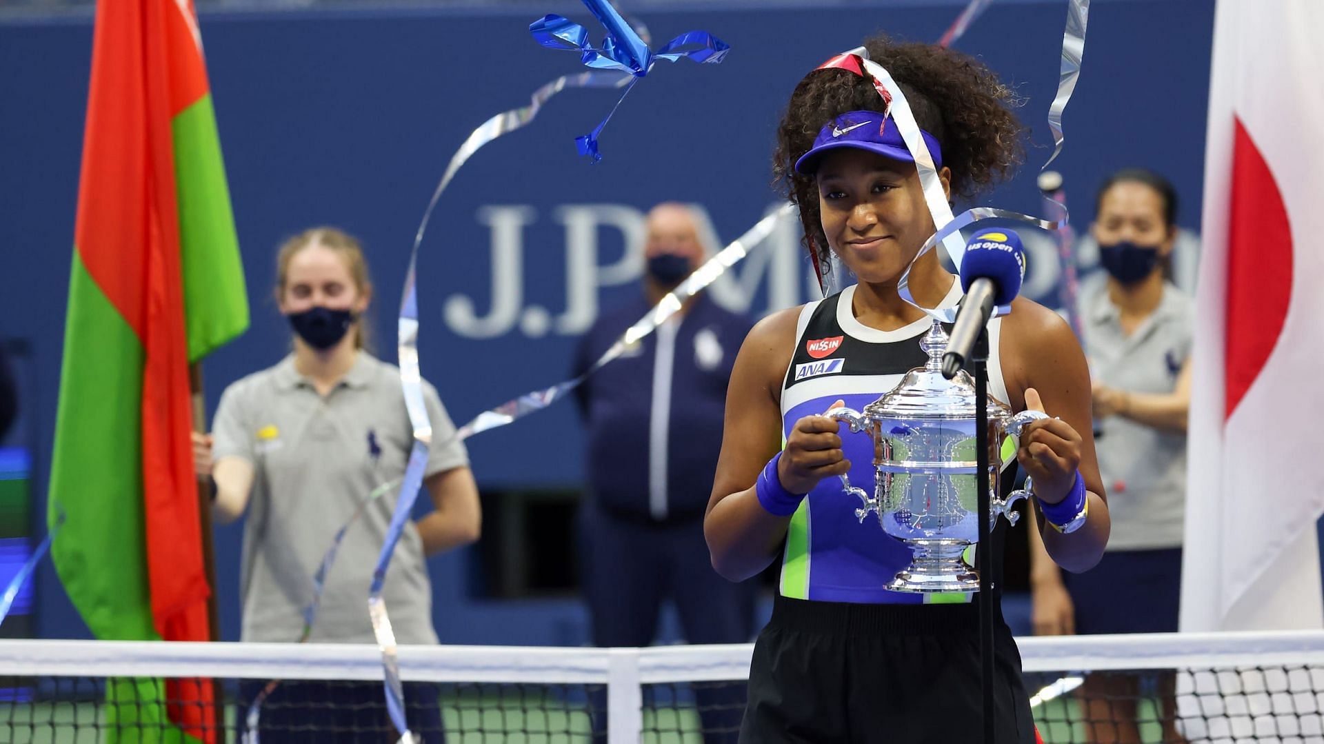 Naomi Osaka poses with the US Open trophy