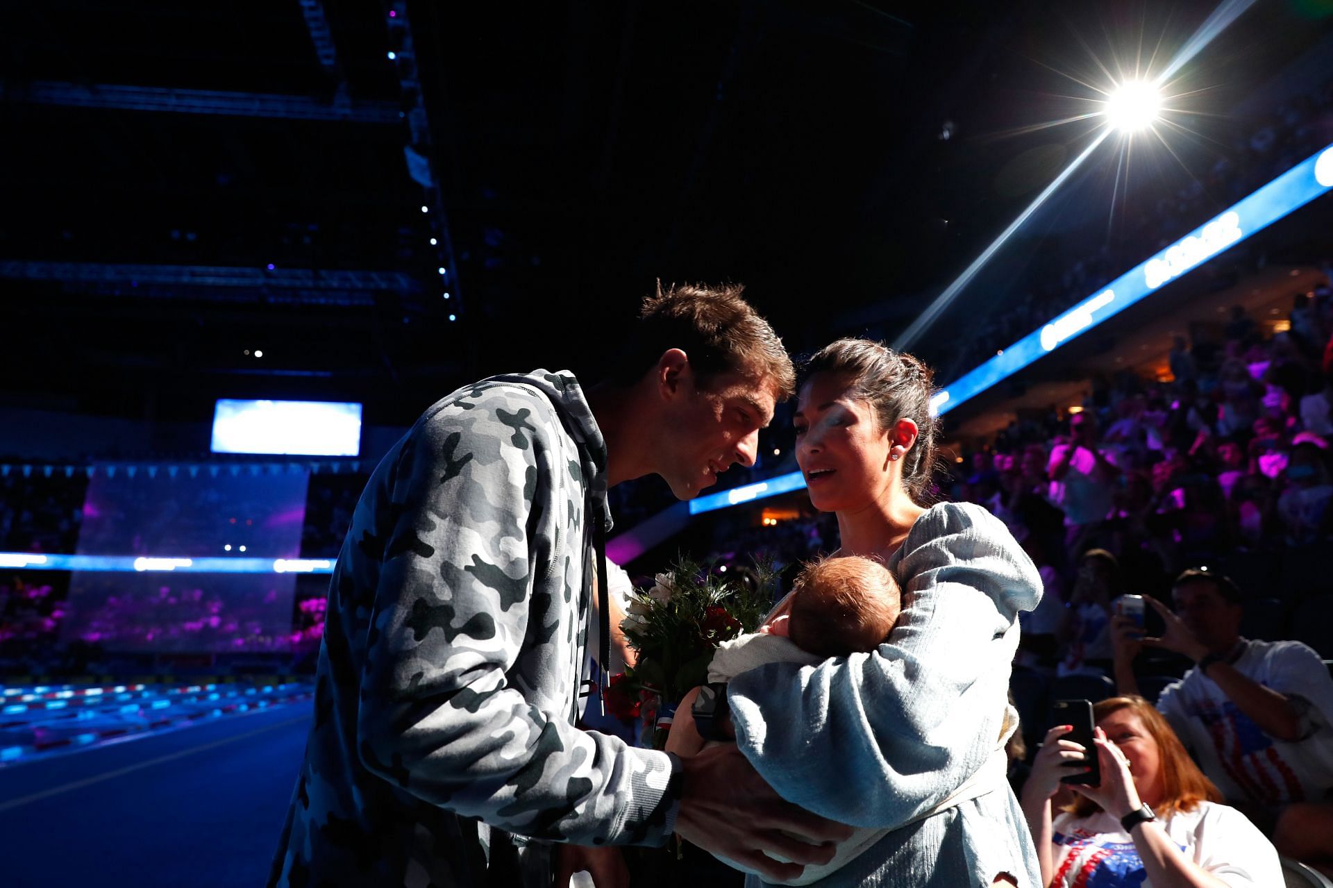 Michael Phelps celebrates with Nicole Johnson and their son Boomer after finishing first in the final heat for the Men&#039;s 200 Meter Individual Medley during the 2016 U.S. Olympic Team Swimming Trialsin Omaha, Nebraska.