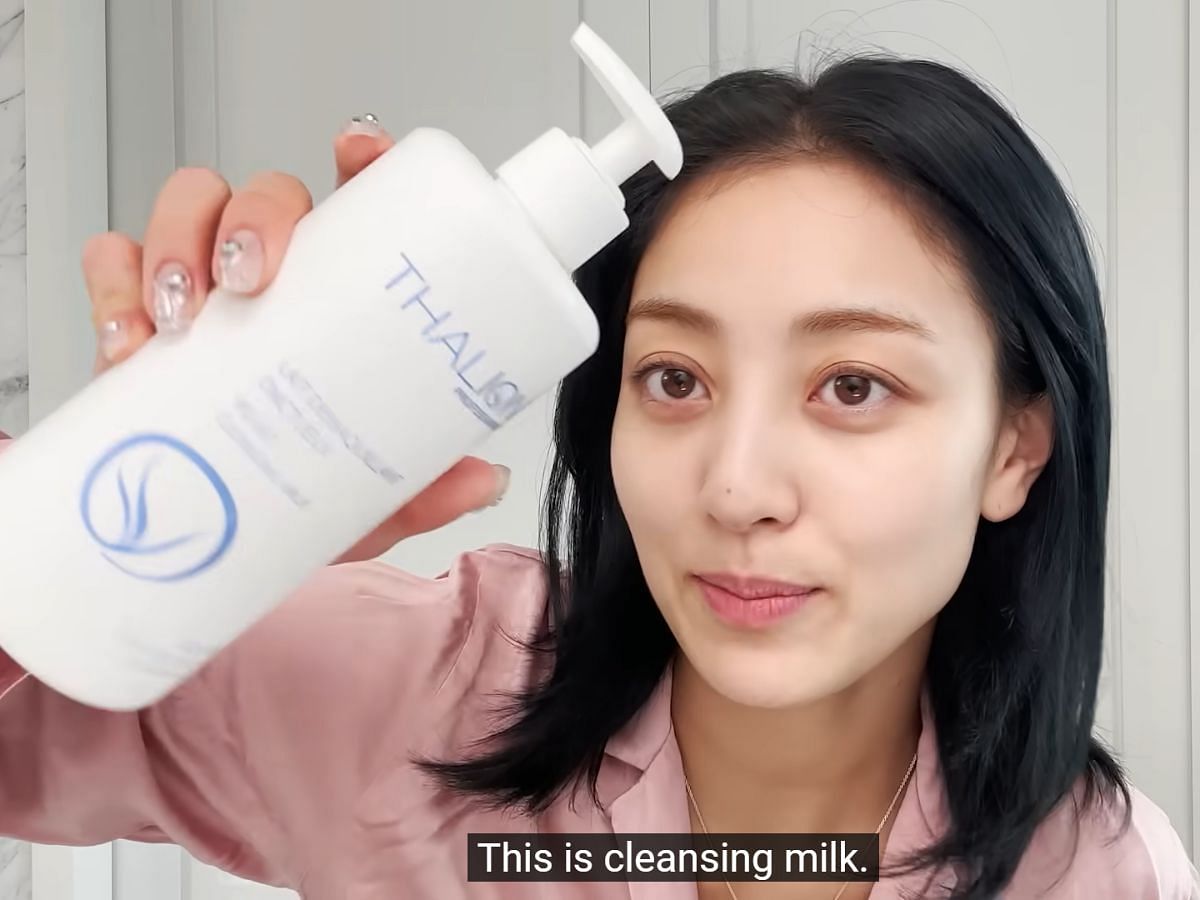 Twice Jihyo uses the Thalion Velvet Cleansing Milk (Image via Youtube/ @Vogue)