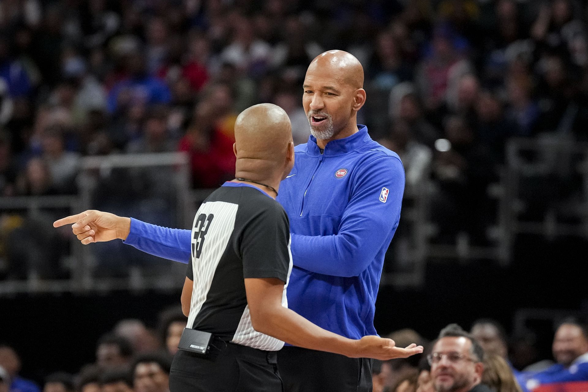 Monty Williams speaks with a referee