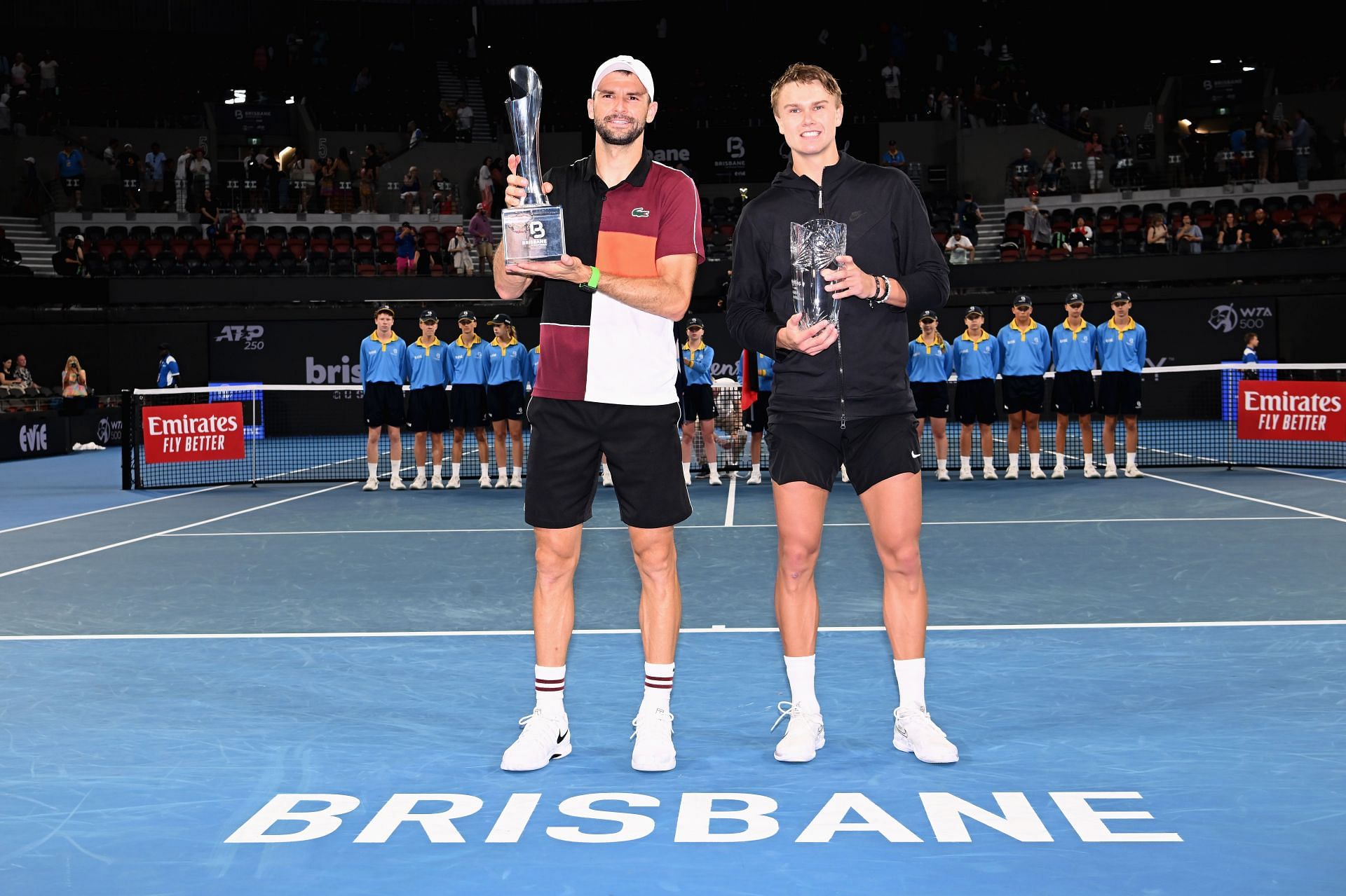 Grigor Dimitrov (L) and Holger Rune pose after their 2024 Brisbane International final.