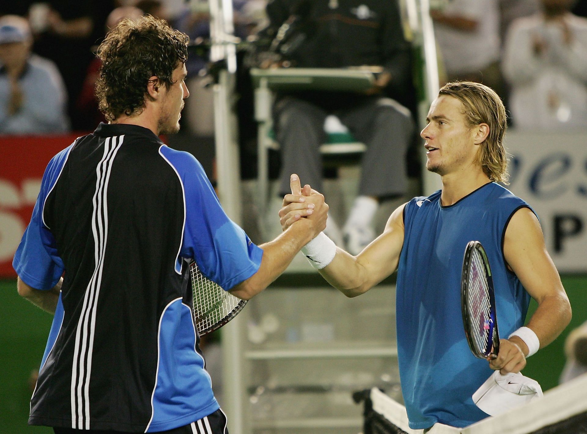 Lleyton Hewitt greets Marat Safin after their 2005 Australian Open clash