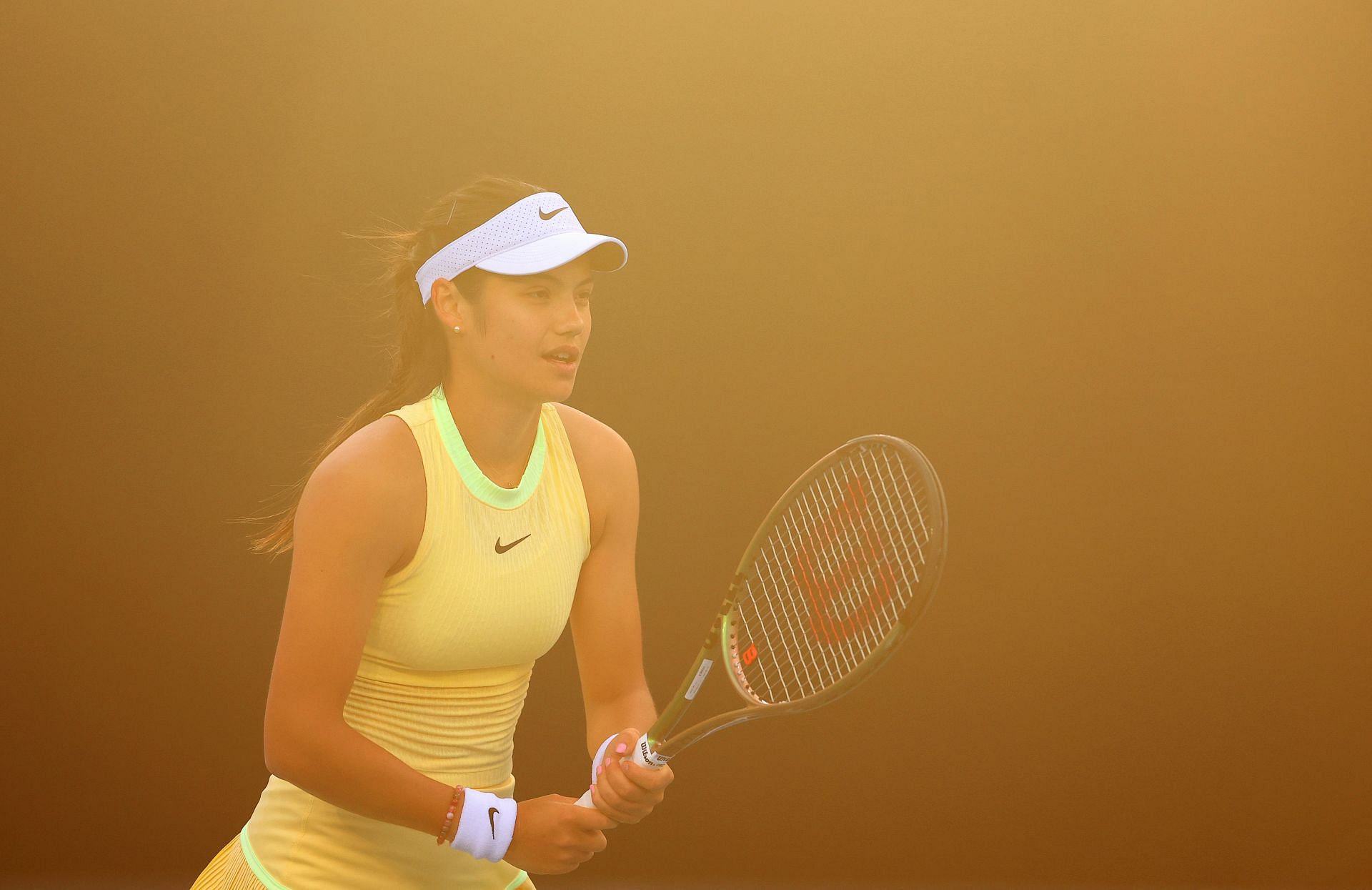 Emma Raducanu prepares to return a serve at the Aus Open 2024 - Day 5