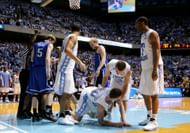 North Carolina's Tyler Hansbrough, who had been taken down by Duke's Gerald Henderson and whose face was about to turn into a near-pool of blood from the play,.