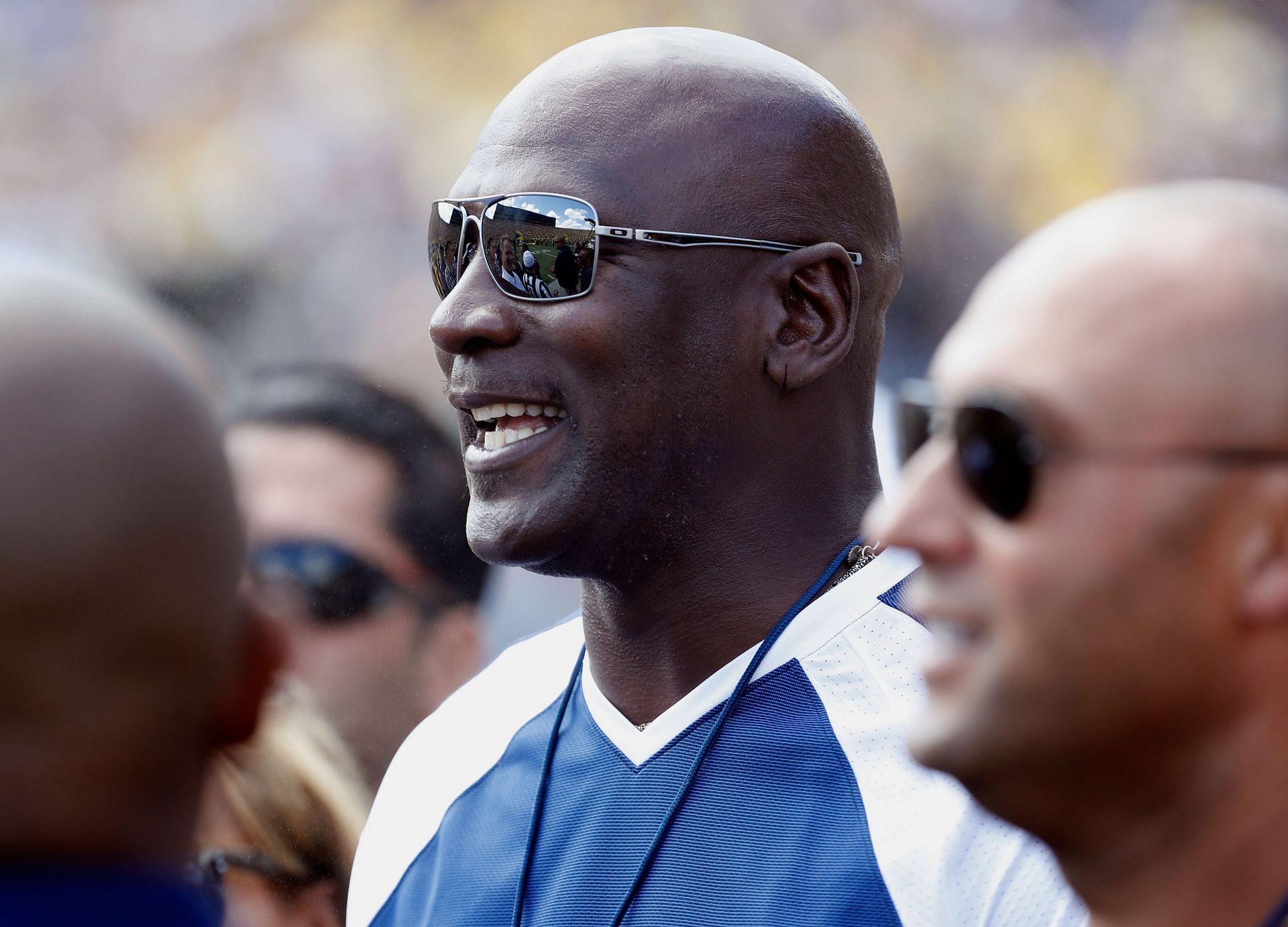 Michael Jordan watches Michigan in action alongside Derek Jeter (2016)