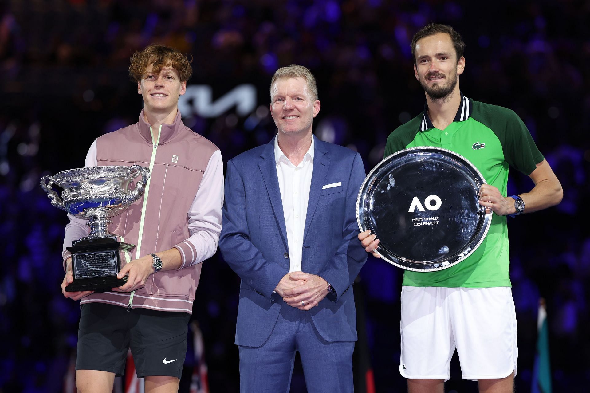 Sinner and Medvedev pictured with Jim Courier at the 2024 Australian Open