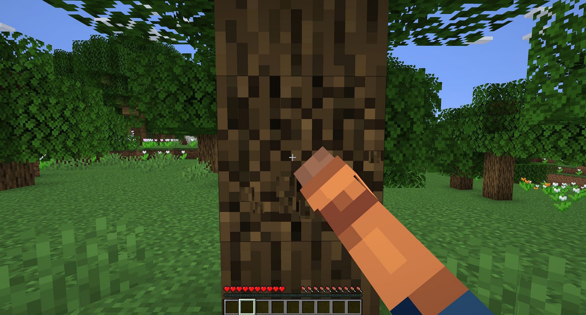 A player punching a tree (Image via Mojang)