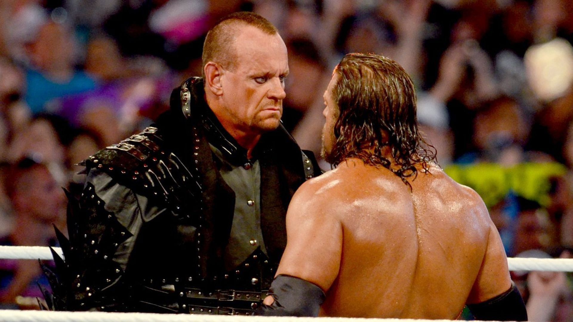 The Undertaker and Triple H face off in WWE ring