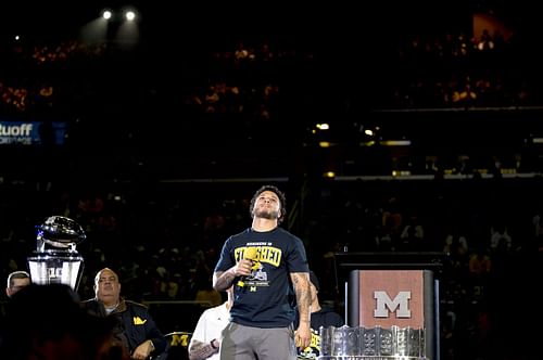 Blake Corum #2 of the Michigan Wolverines looks on during his speech during the Michigan Wolverines football National Championship celebration on January 13, 2024 at Crisler Center in Ann Arbor, Michigan. (Photo by Nic Antaya/Getty Images)