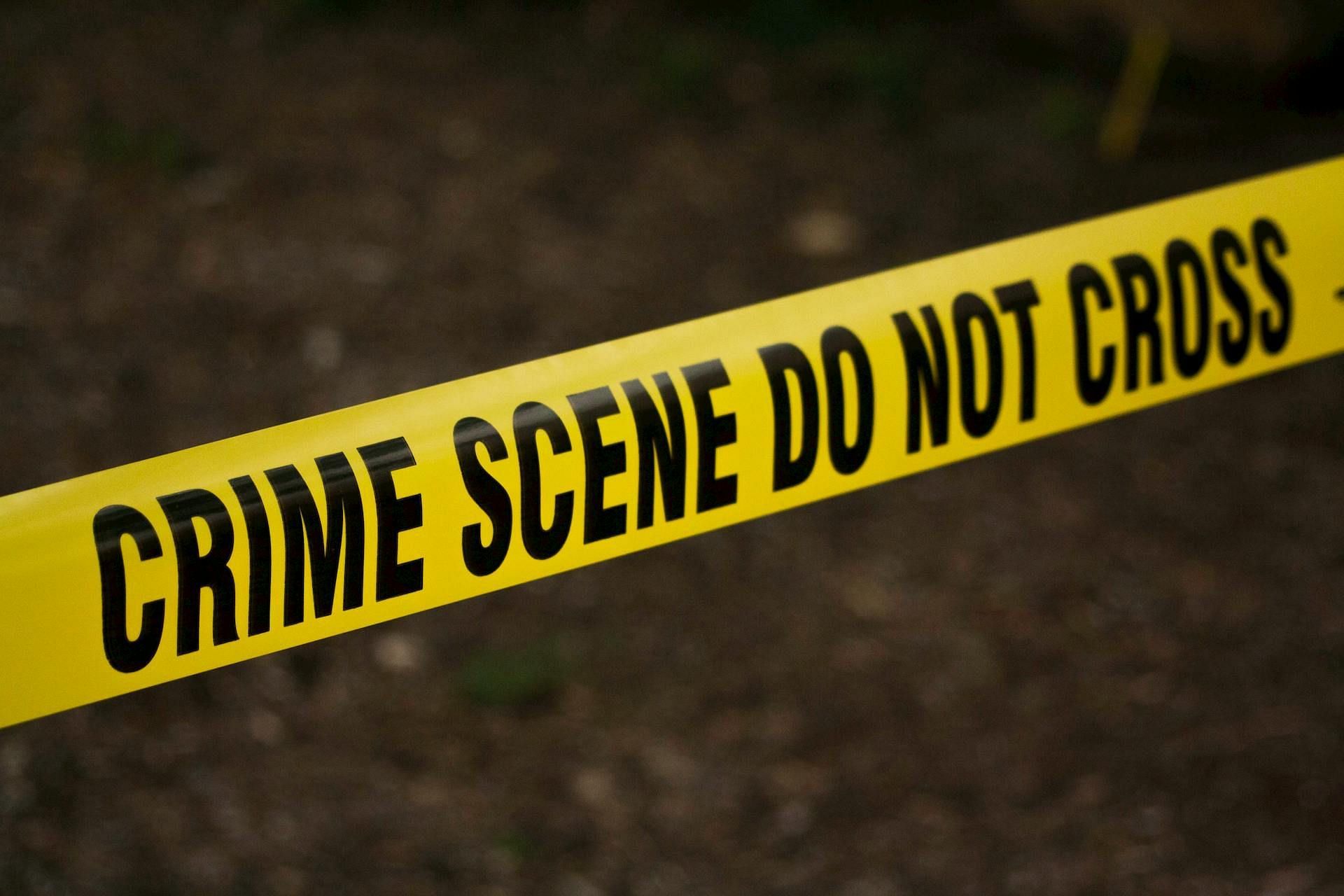 A representative image of crime scene tape is used. (Image via Pexels)
