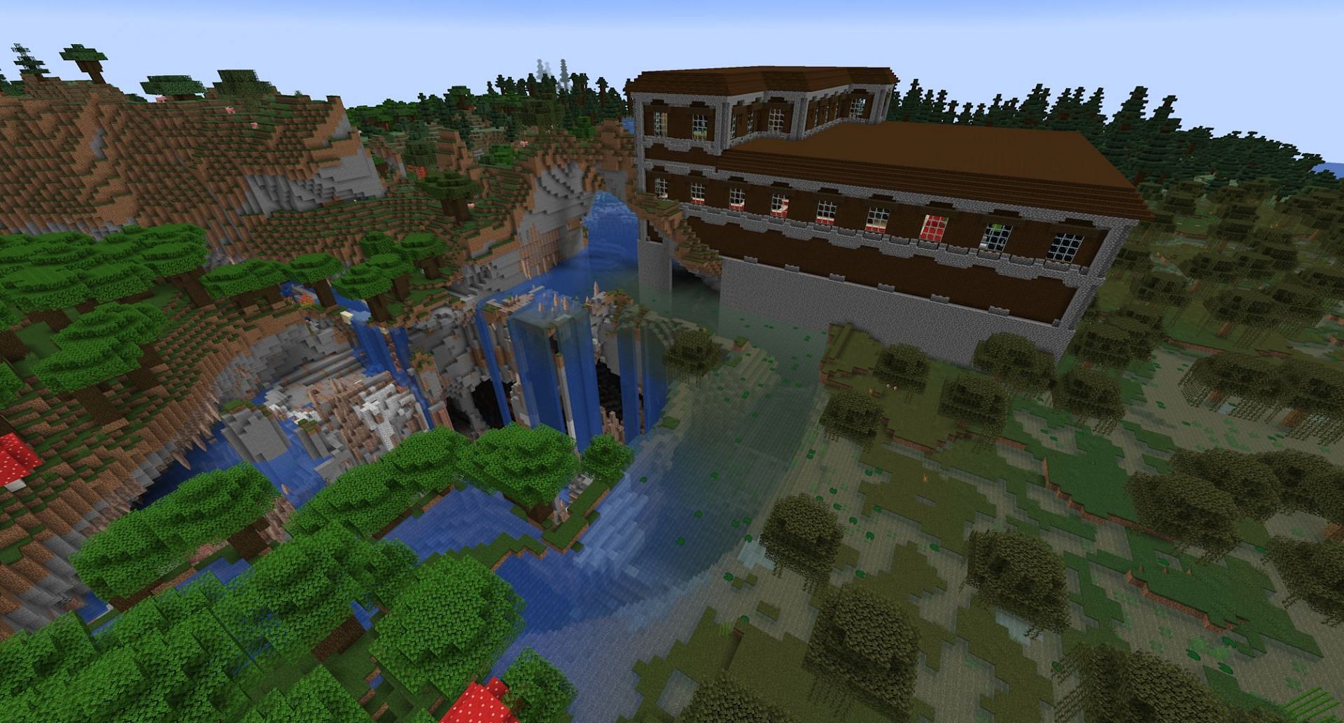 Le manoir avec l'immense grotte en dessous (Image via Mojang)