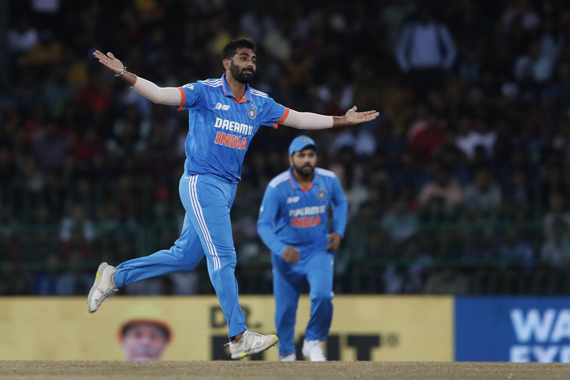 Jasprit Bumrah celebrates picking a wicket for India.