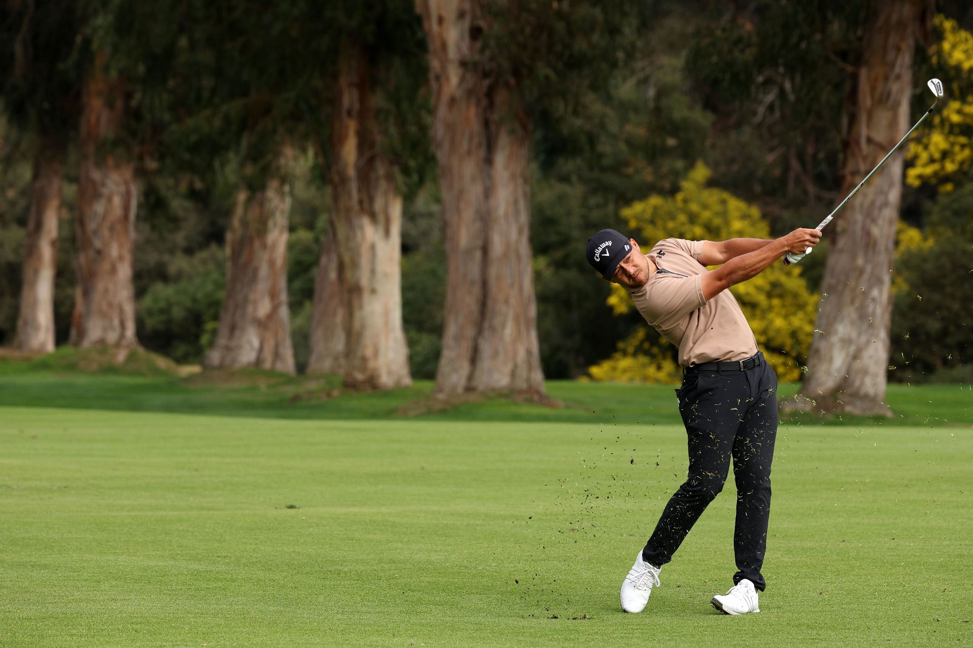 Xander Schauffele plays a second shot on the 13th hole during the final round of The Genesis Invitational