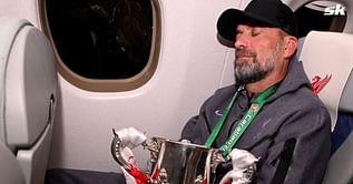 Liverpool boss Jurgen Klopp pictured sleeping with trophy in hand after League Cup final win over Chelsea