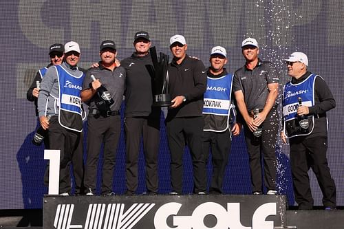 Talor Gooch, Brooks Koepka, Graeme McDowell, and Jason Kokrak pose after winning the LIV Golf Las Vegas