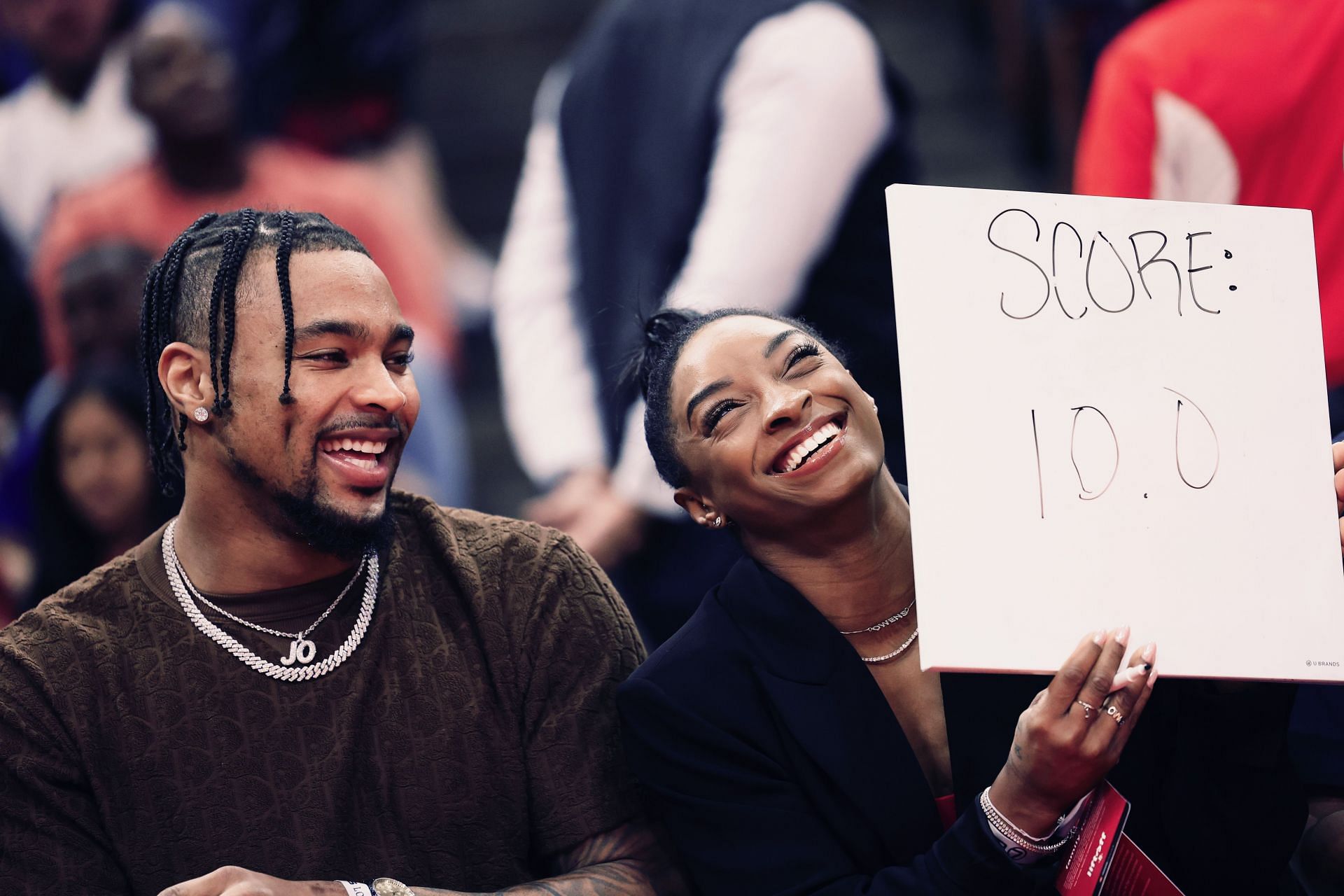 Simone Biles and Jonathan Owens attend a game between the Houston Rockets and the Los Angeles Lakers at Toyota Center in Houston, Texas.