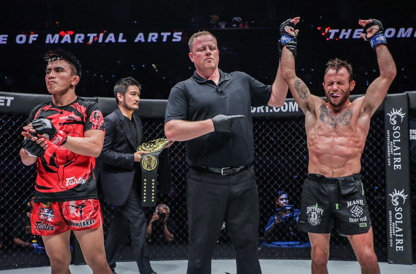 Joshua Pacio (L) losing his strawweight MMA world title to Jarred Brooks (R) | Photo by ONE Championship