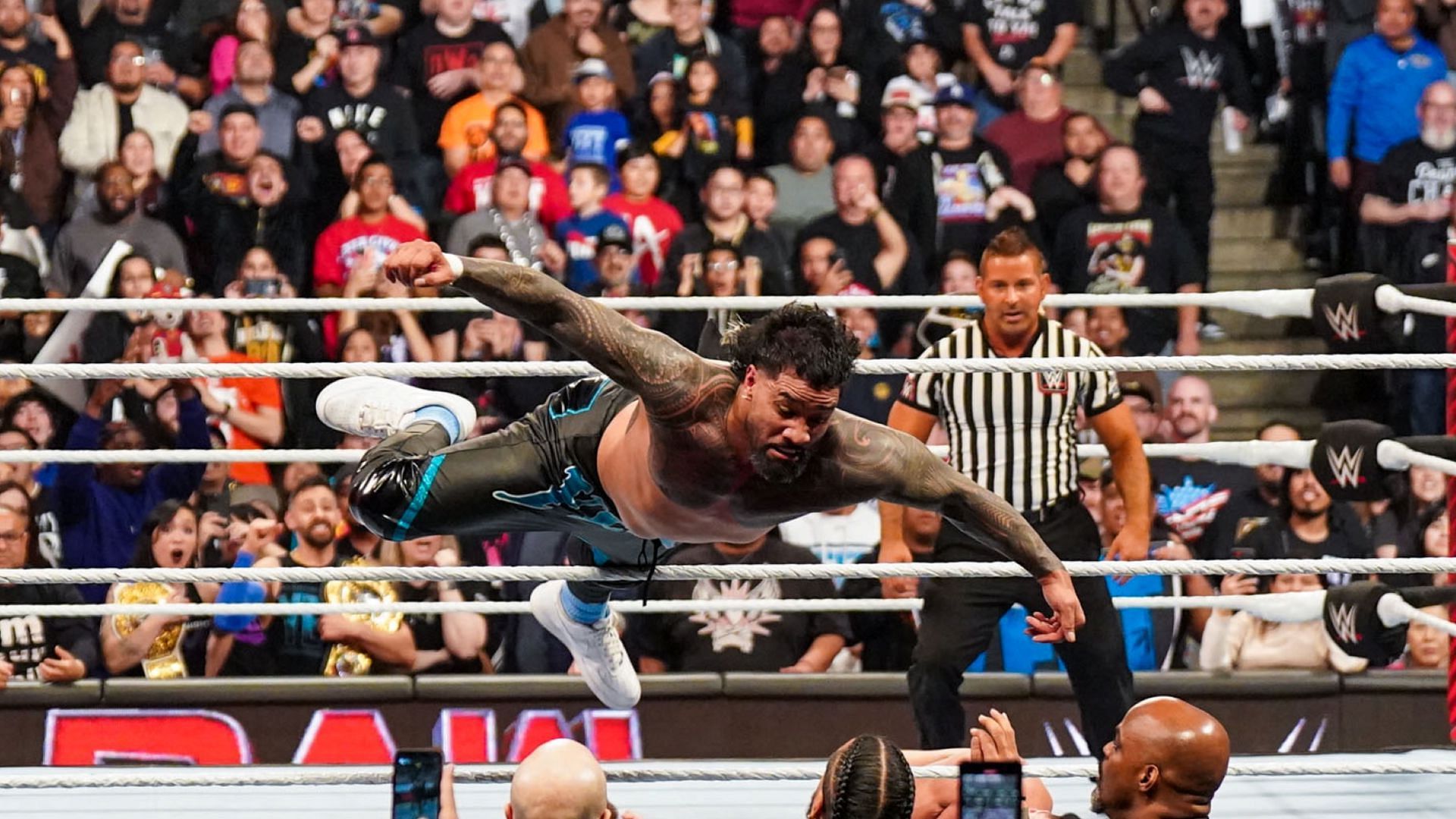 Jey Uso nails a big dive to the floor on WWE RAW