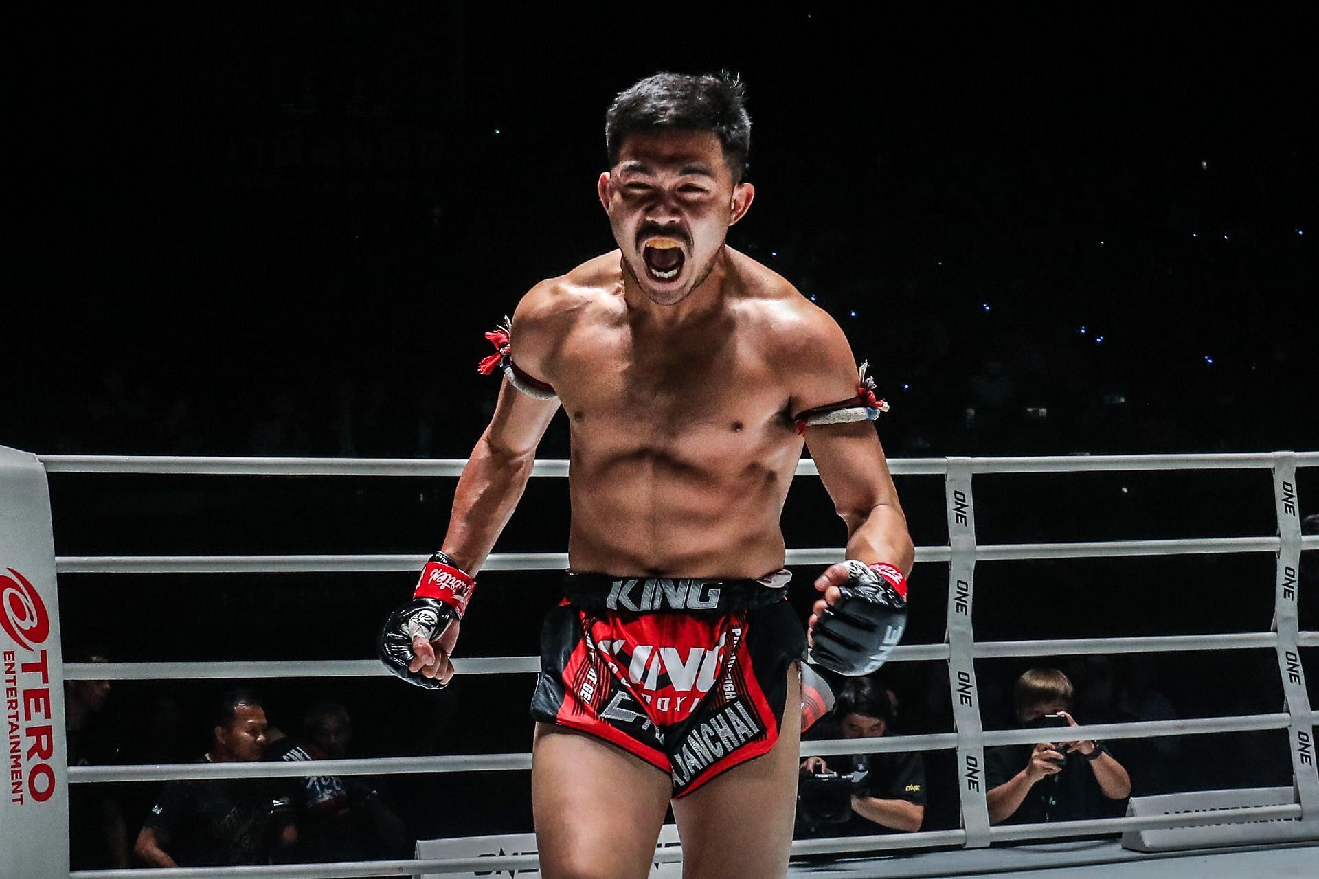 Prajanchai celebrates after unifying the ONE Championship strawweight Muay Thai titles by knocking out Joseph Lasiri.